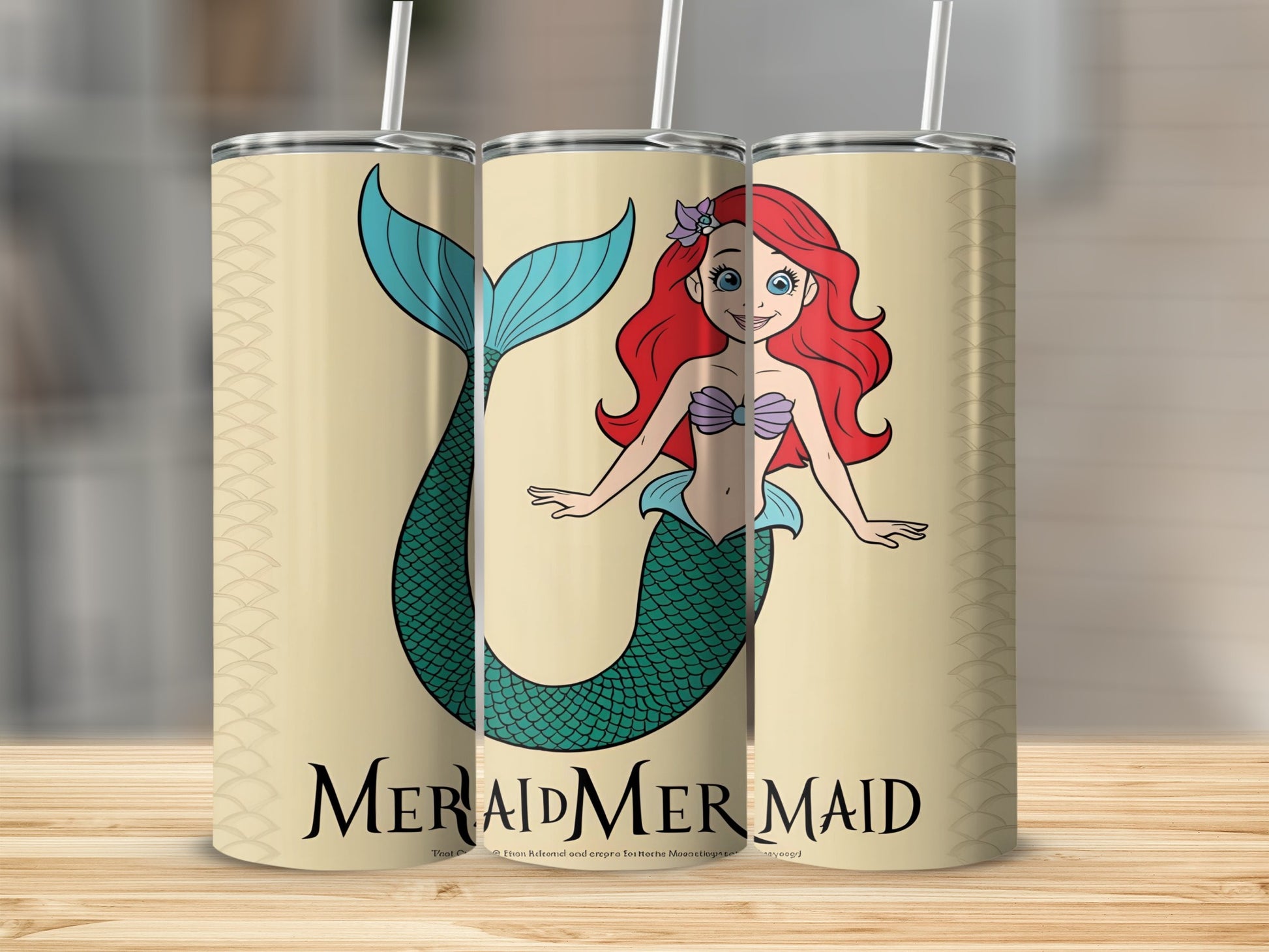 Ariel mermaid illustration on a patterned tumbler with a straw.