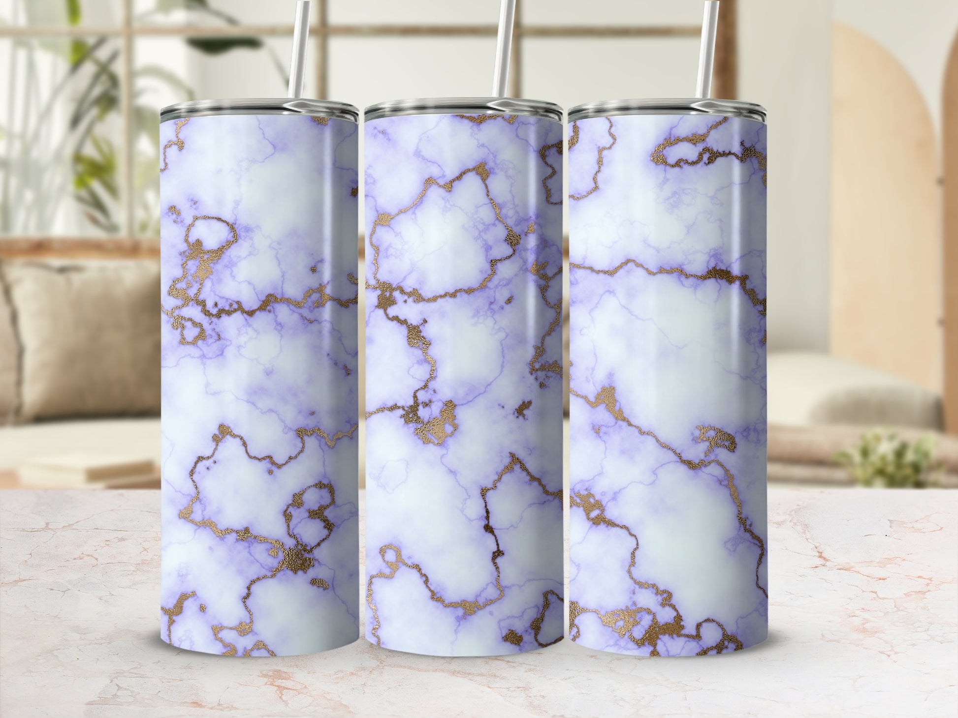 Tumbler with purple and gold marble design, on a light surface.
