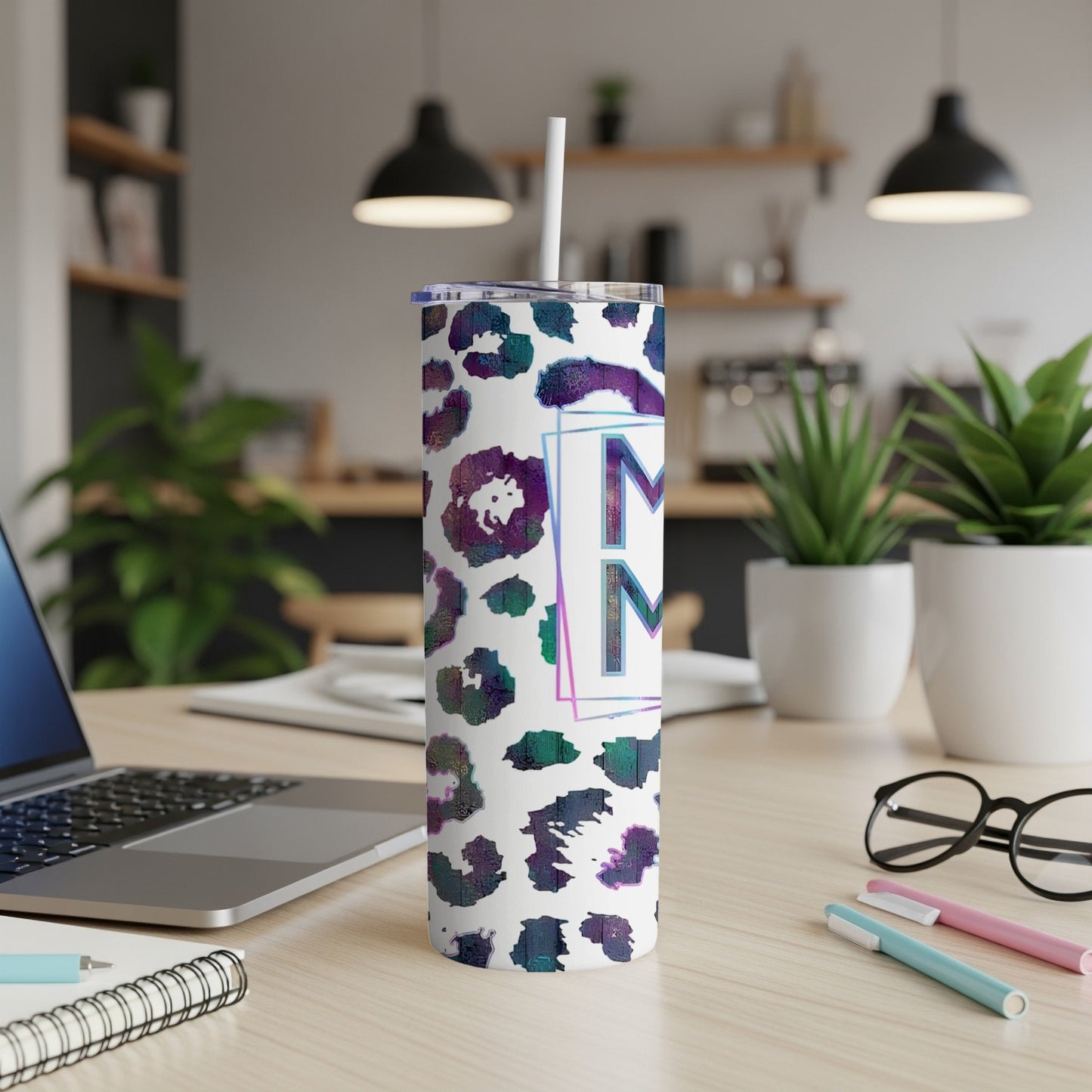 Tumbler with a marbled leopard print and the letter "M".