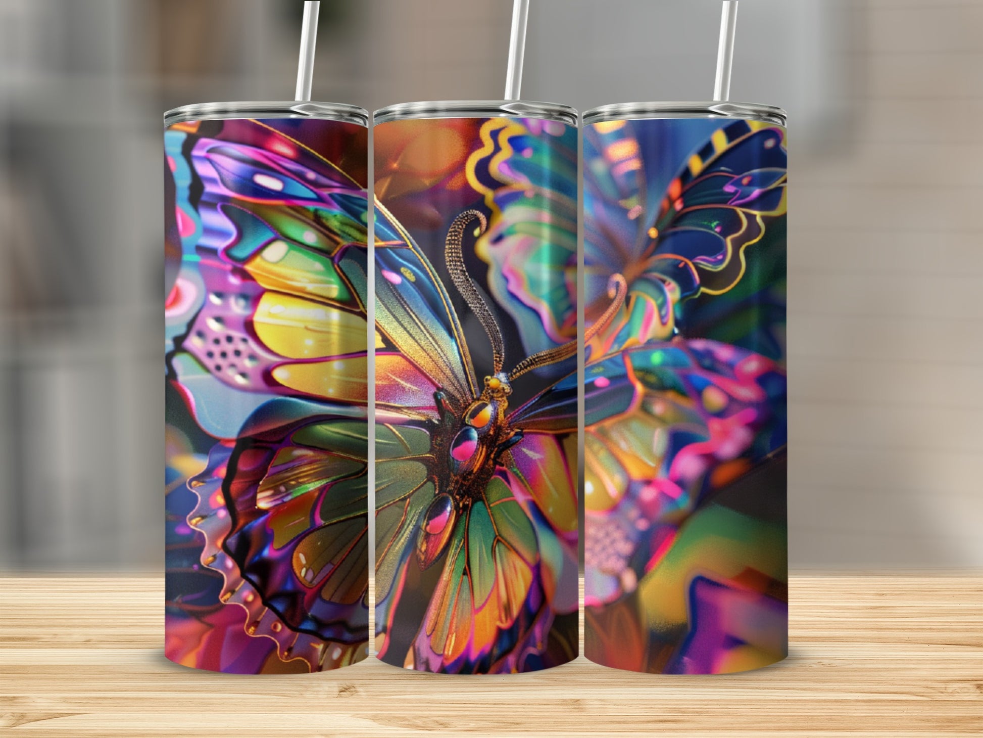 Triptych of tumblers featuring a vibrant, iridescent butterfly design.