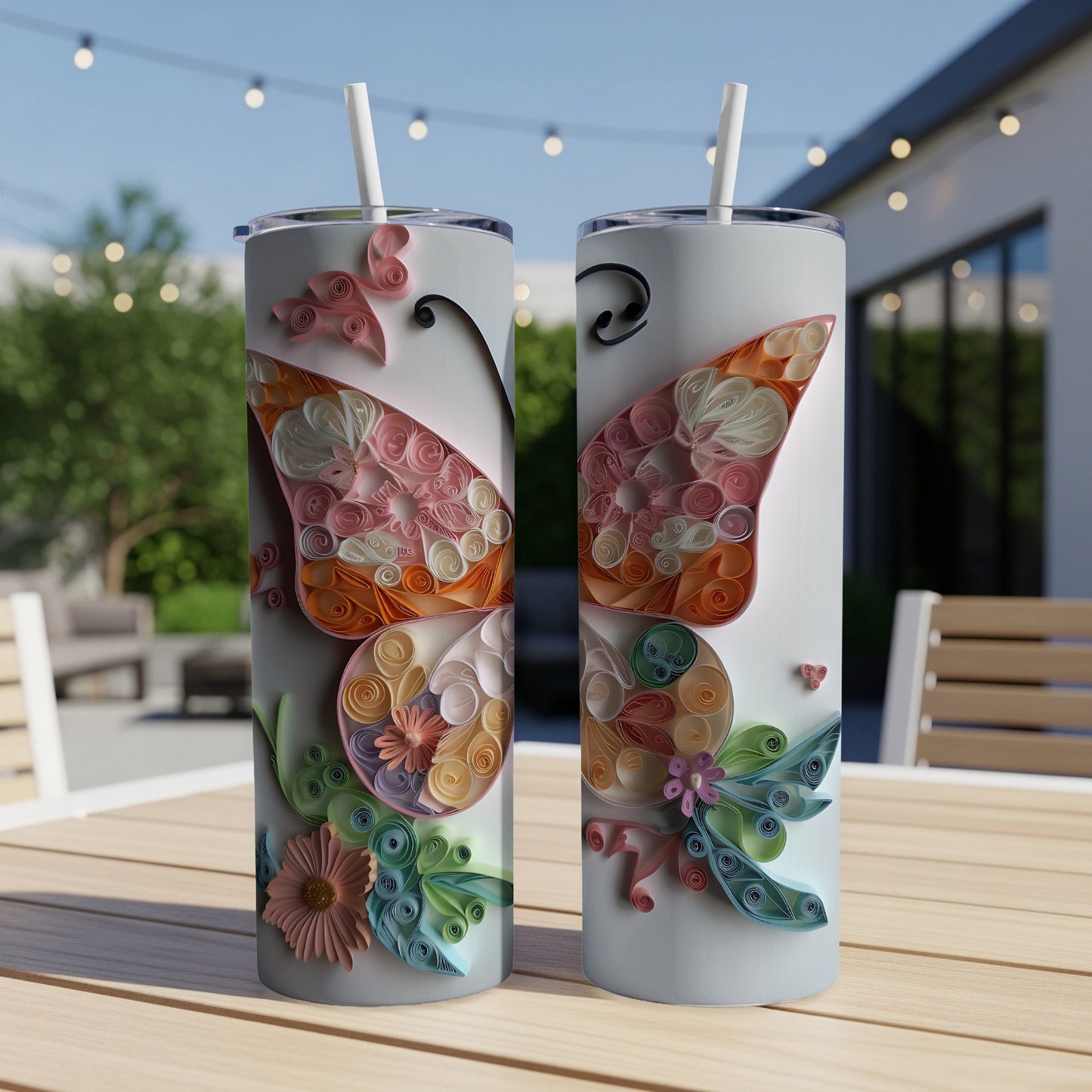 Two tumblers with a delicate butterfly design made of quilled paper.