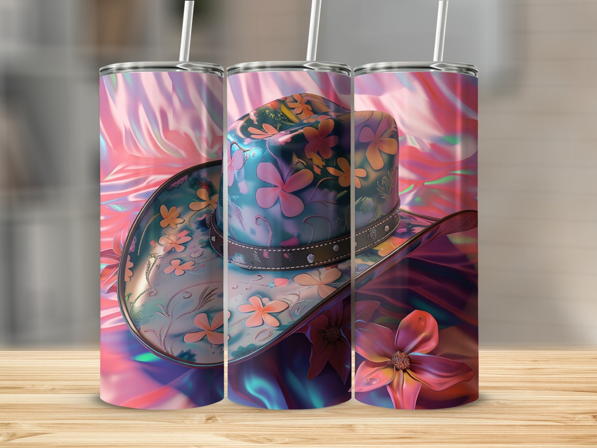 Three cowboy hats with floral designs on a wooden surface.