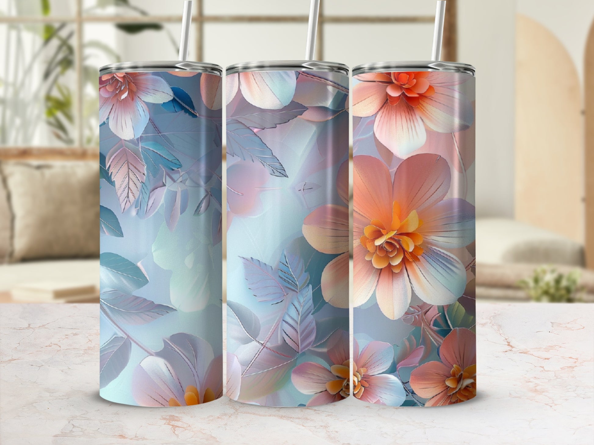 Three tumblers with floral designs, featuring peach and blue petals and leaves.