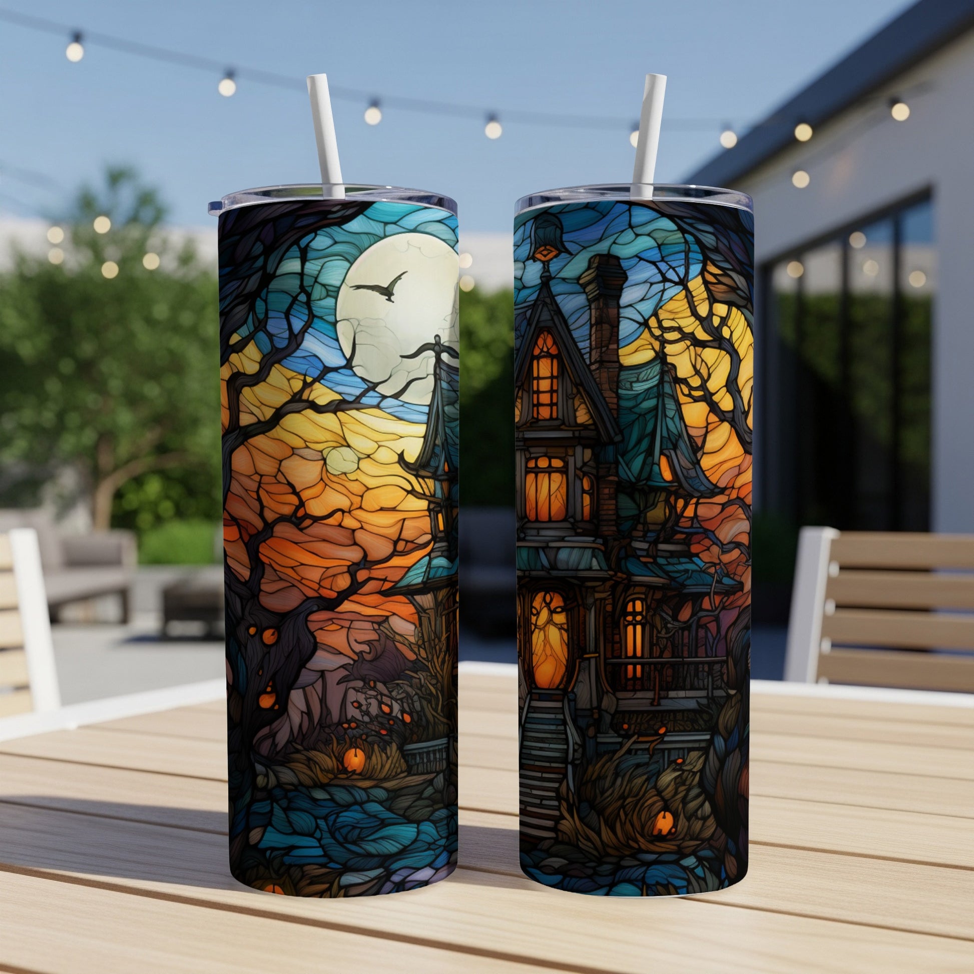 Halloween haunted house scene with moon and bats on a tumbler.