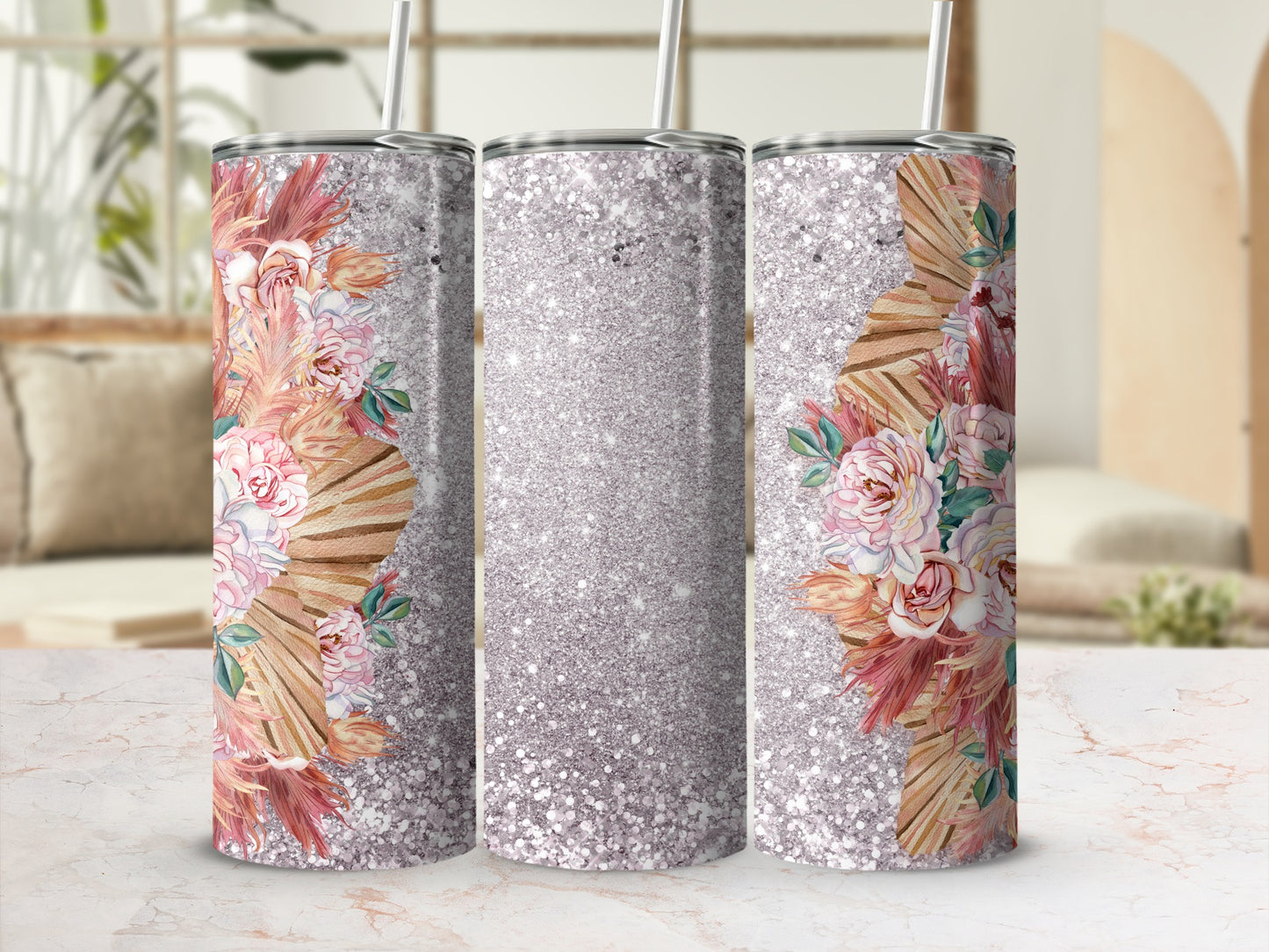 Pink and beige floral design on glitter tumbler with straw.