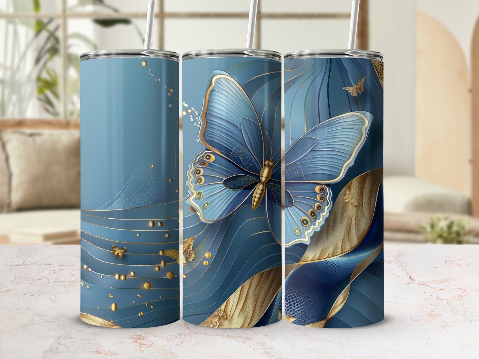 Blue tumbler with gold butterfly and swirling patterns.