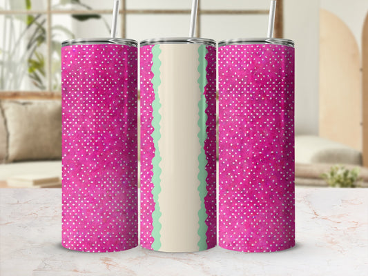 Pink tumbler with white dots and a scalloped green and white band.