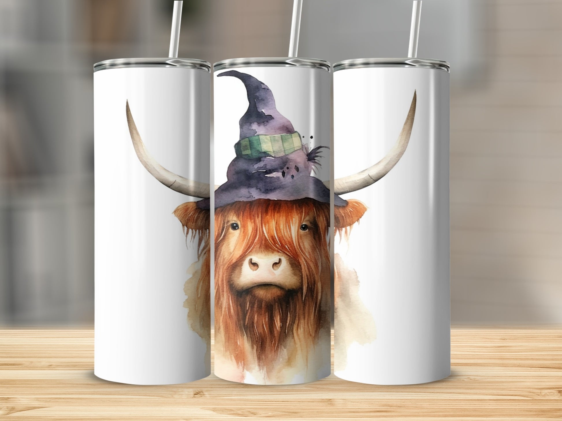Watercolor highland cow wearing a witch hat on a tumbler.