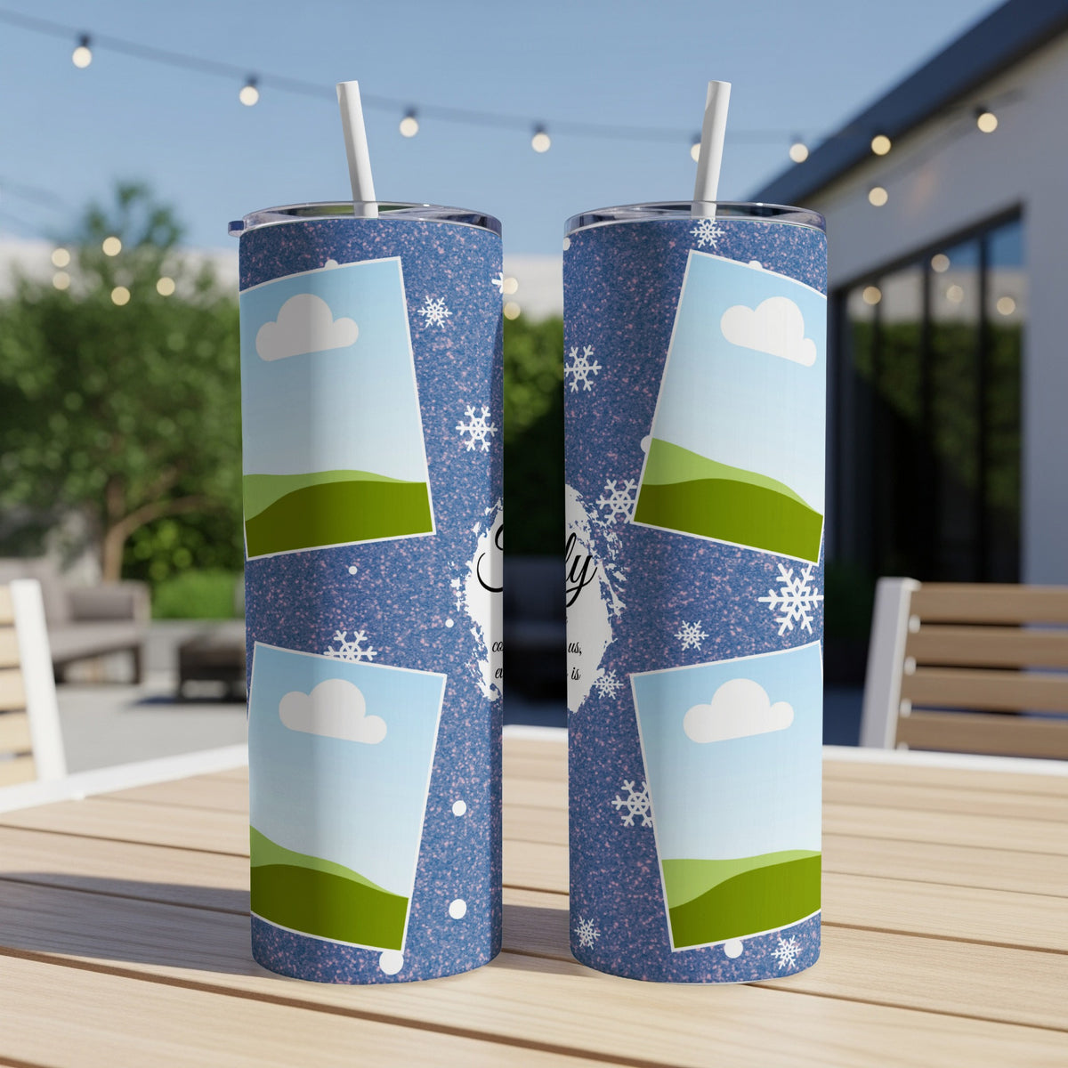 Two blue speckled tumblers with snowflake, cloud, and landscape photo frames.