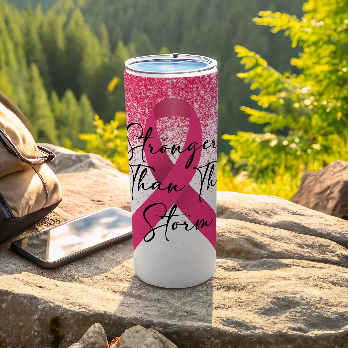 Pink ribbon tumbler with "Stronger Than the Storm" text.