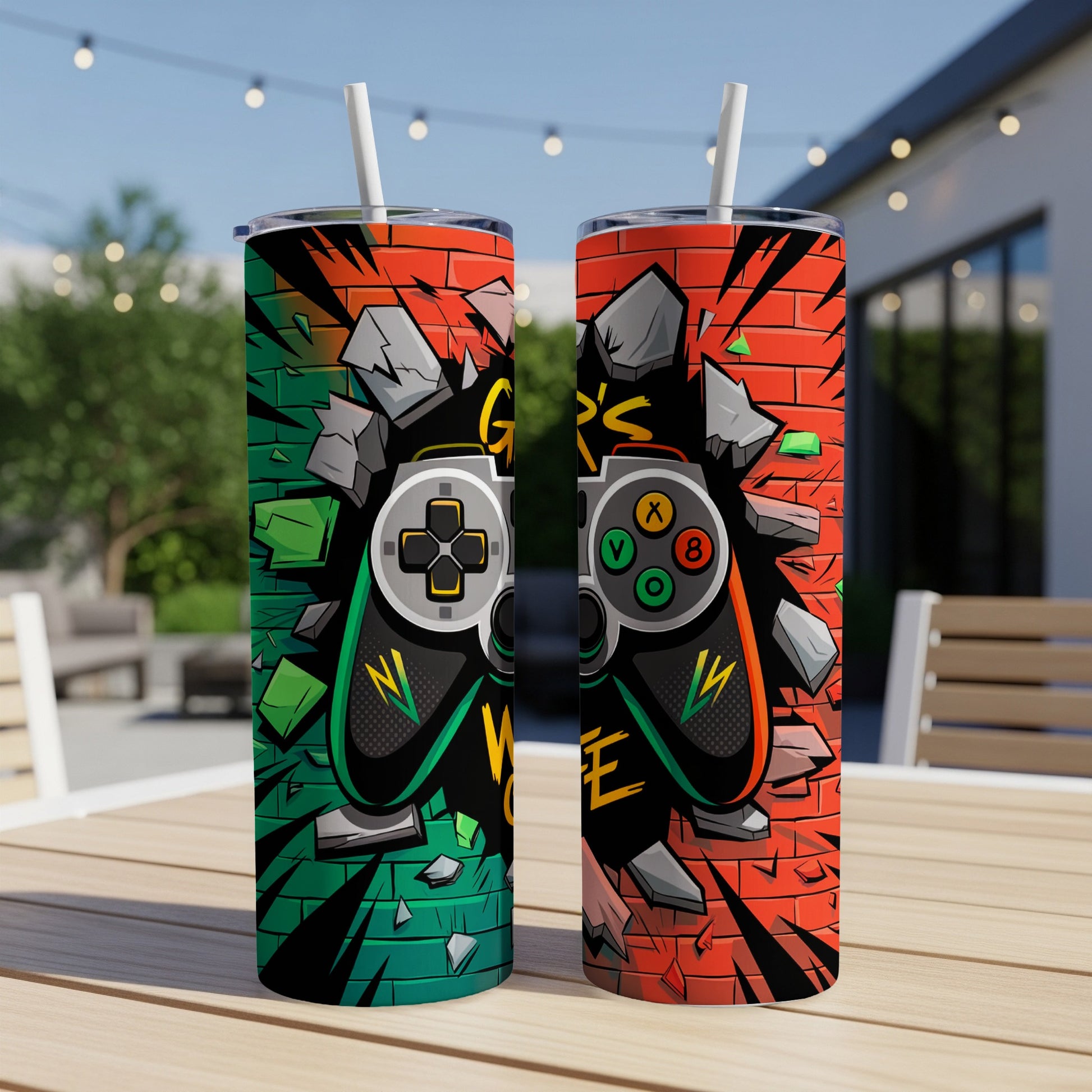 Two tumblers with a video game controller design on a brick wall background.