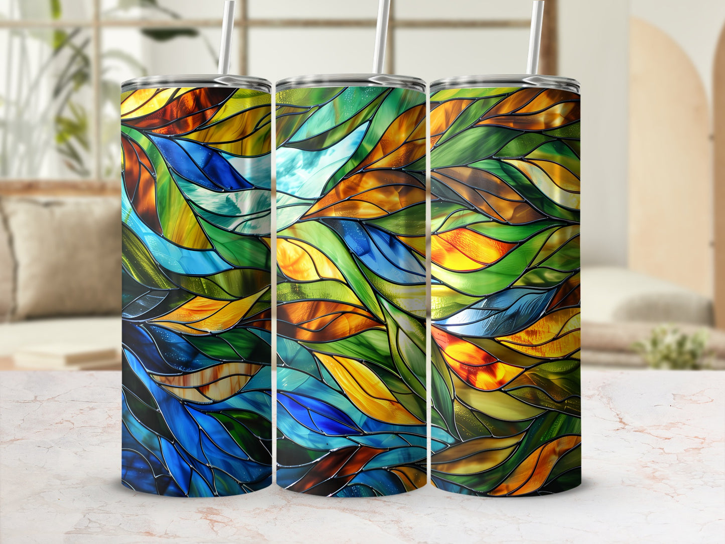 Three tumblers with a stained glass leaf pattern in warm and cool colors.