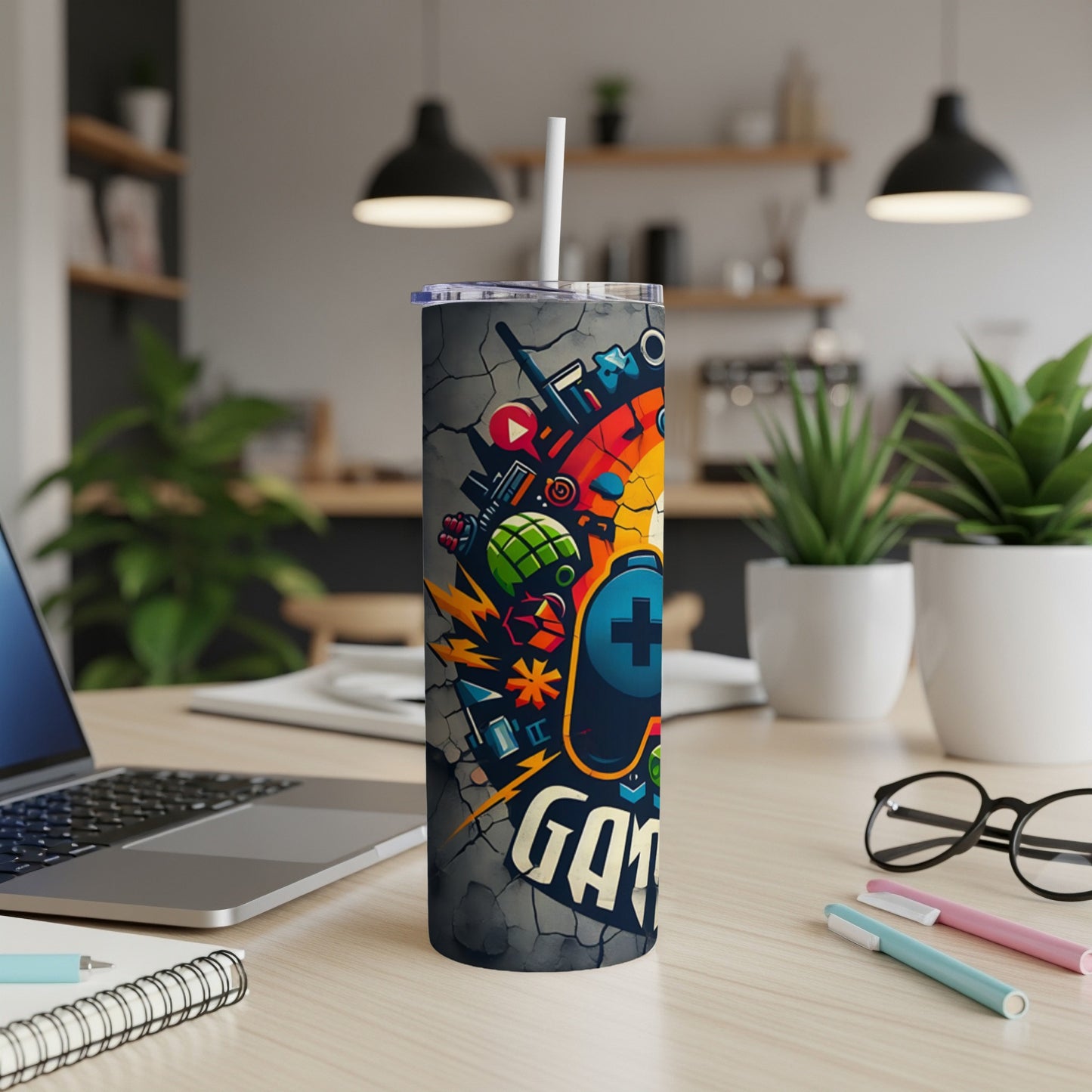 Gray tumbler with gaming icons and "GAMER" text, white straw.