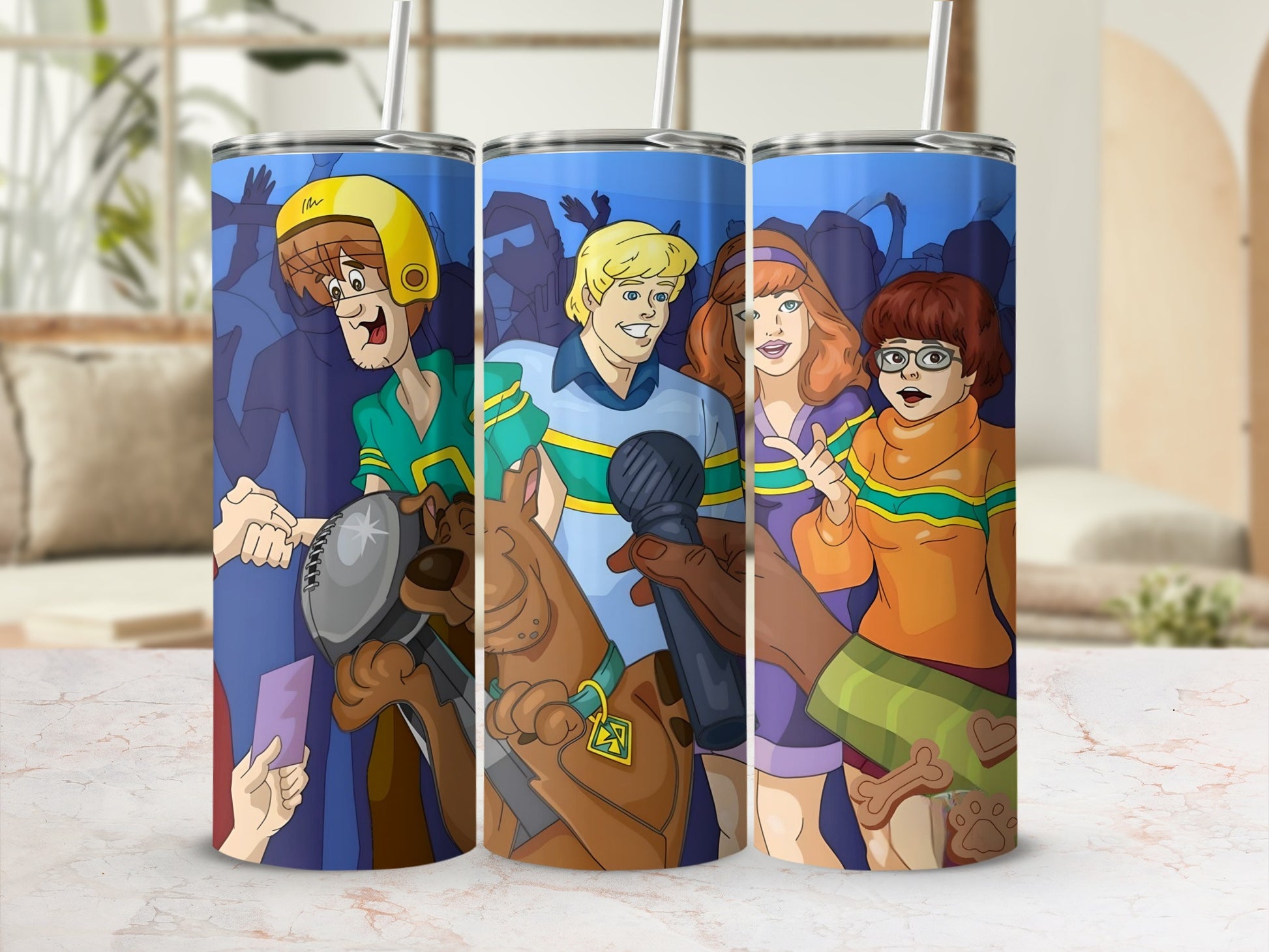 Scooby-Doo characters Fred, Daphne, Velma, and Scooby-Doo on tumblers.