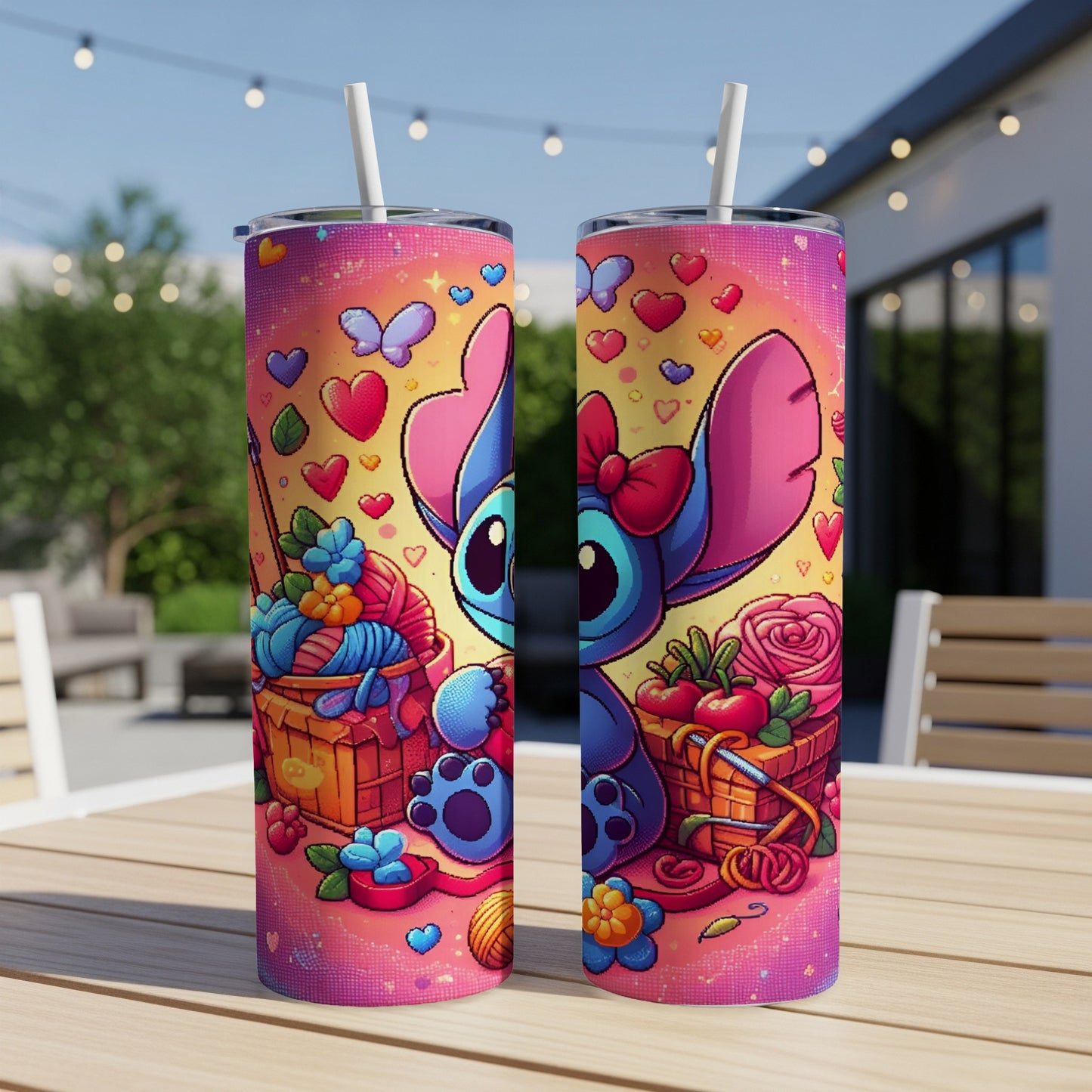 Stitch with yarn and craft supplies on two tumblers, on a table outdoors.