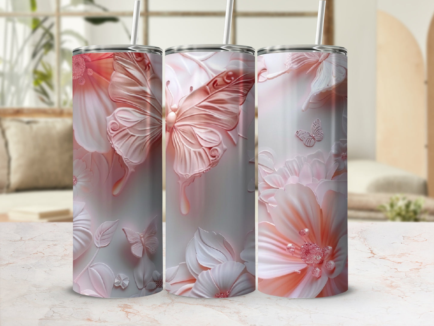 Three tumblers with pink butterfly and floral designs.