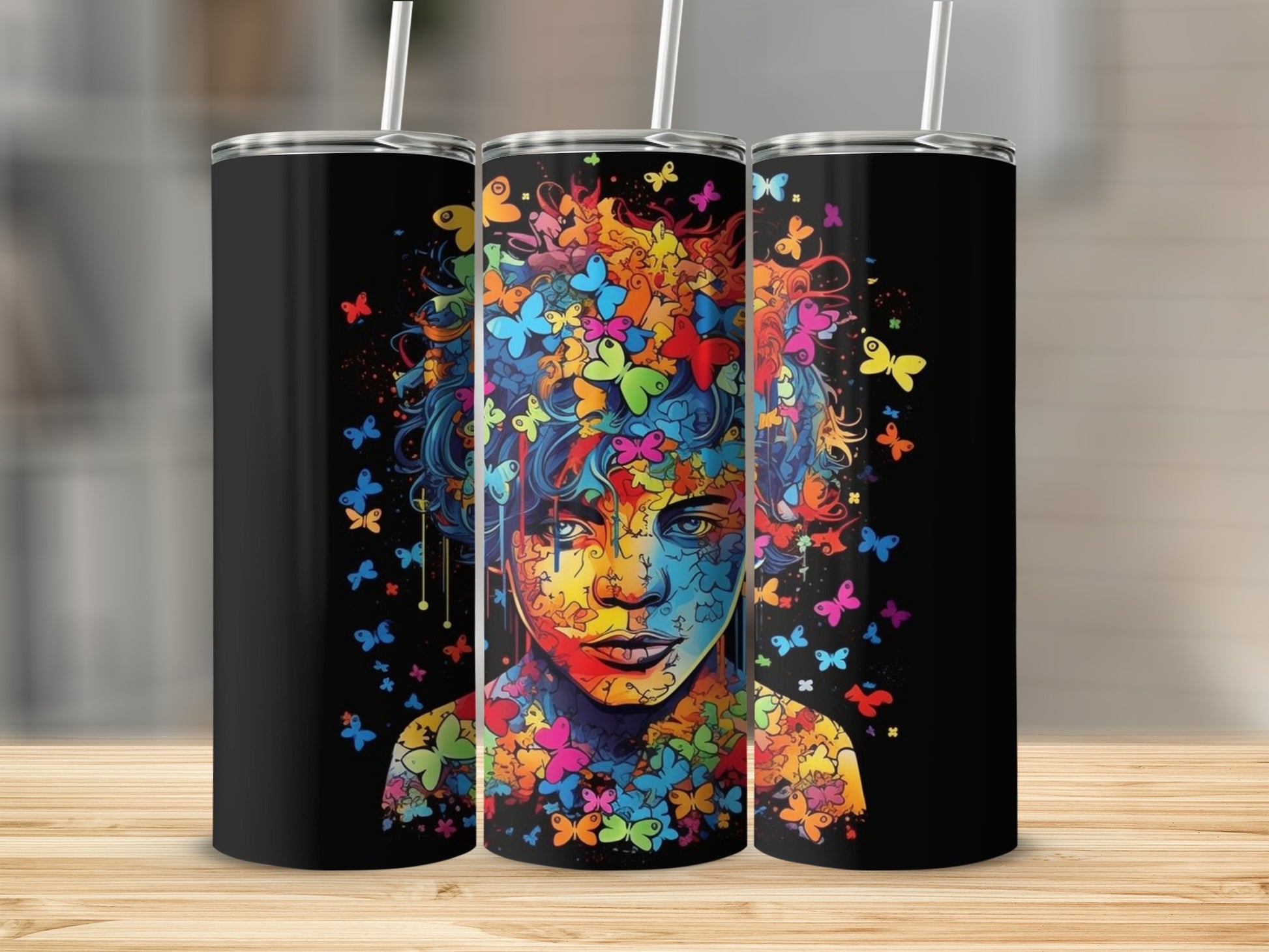 Tumbler with colorful butterfly artwork on black background.
