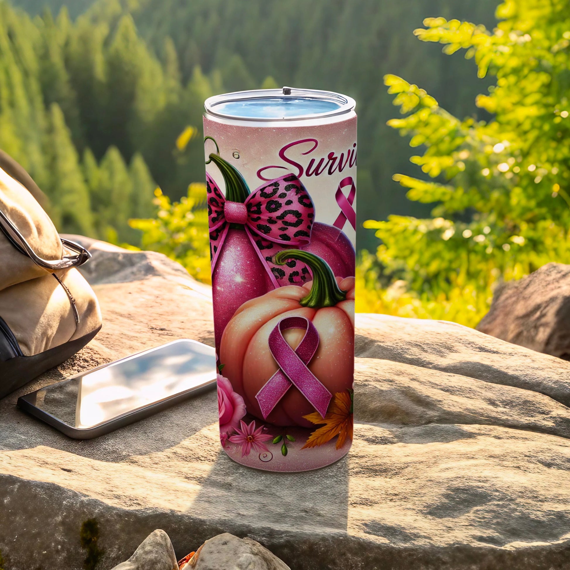Pink ribbon and pumpkins on a tumbler with "Survivor" text.