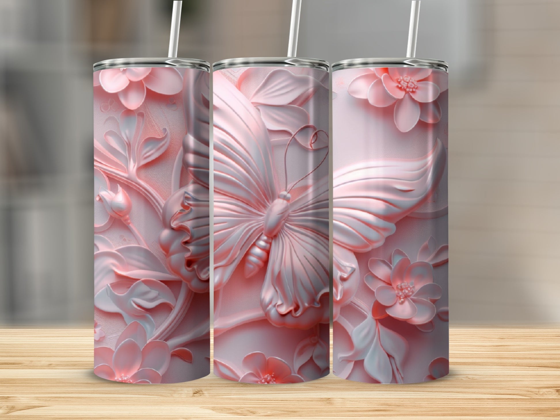 Pink tumbler with embossed butterfly and floral design.