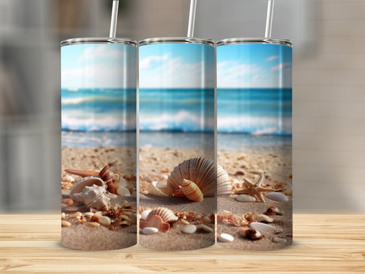 Three tumblers with a beach scene and seashells on sand.