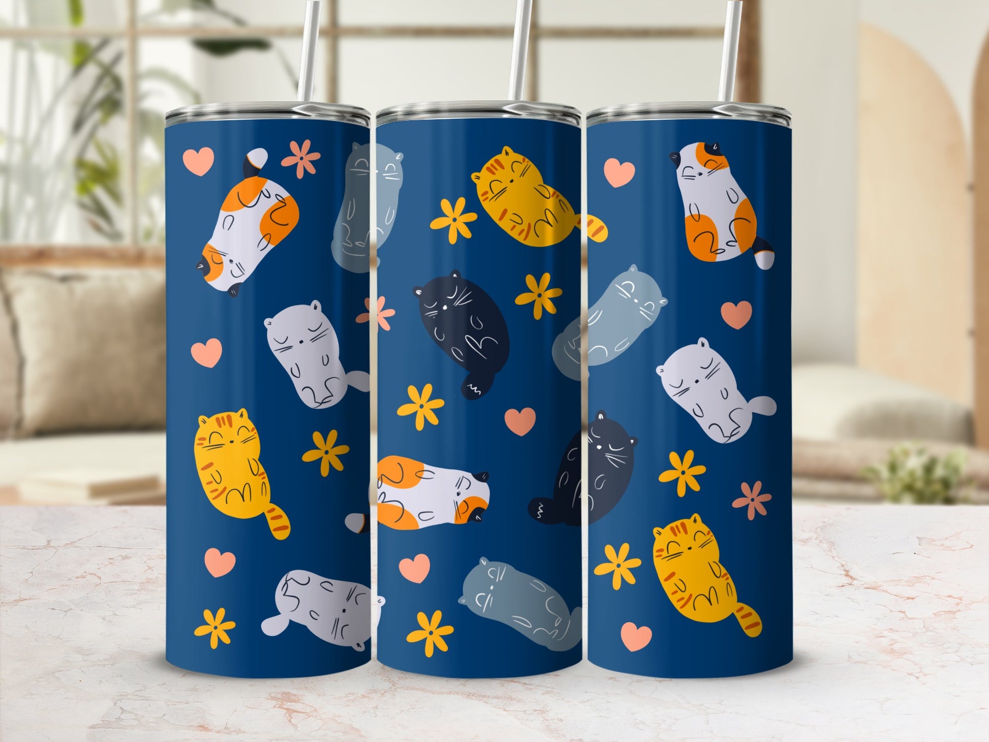 Three blue tumblers featuring a repeating pattern of cute cats and flowers.