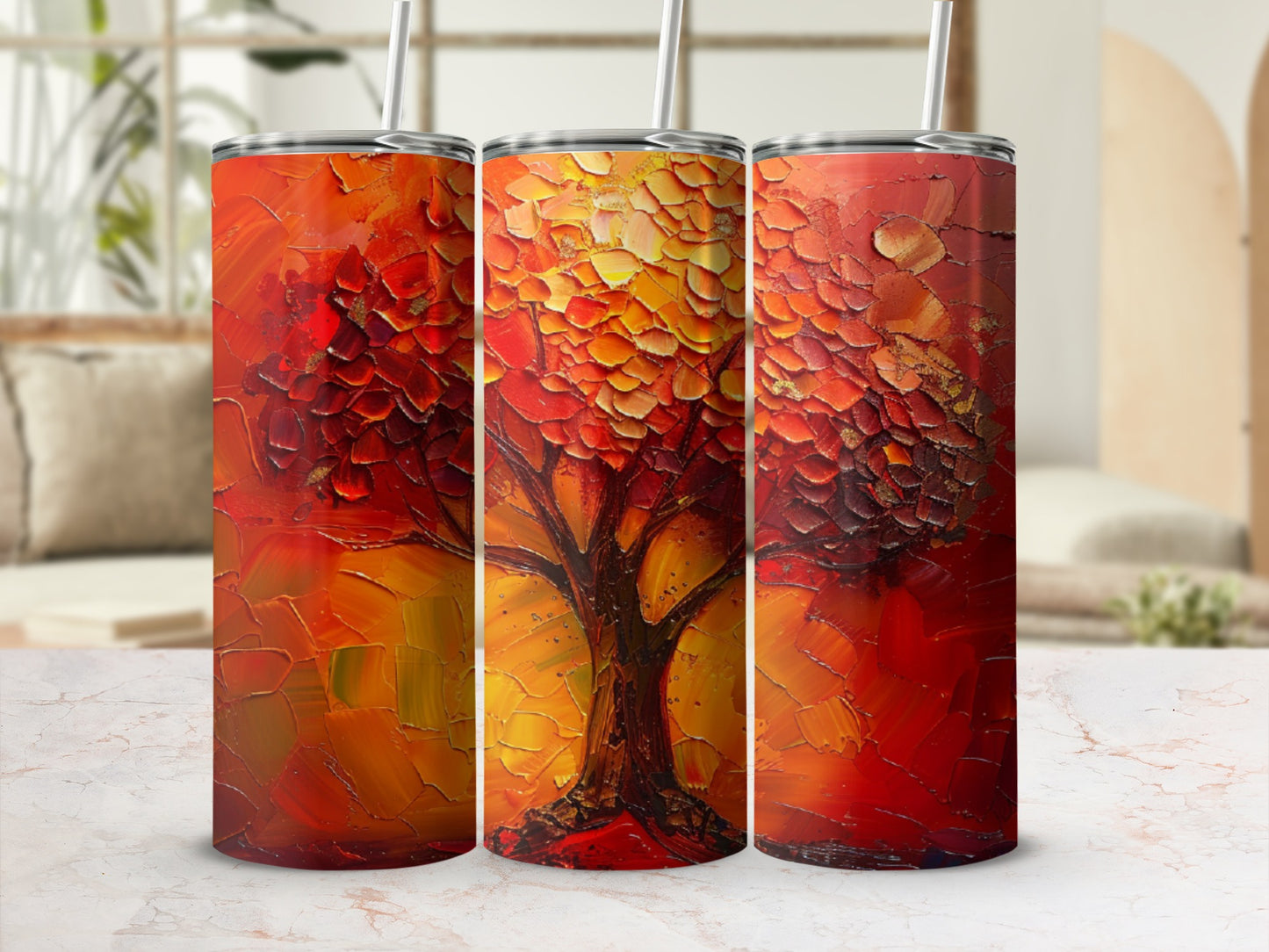 Three tumblers with a textured, abstract tree design in red and gold.