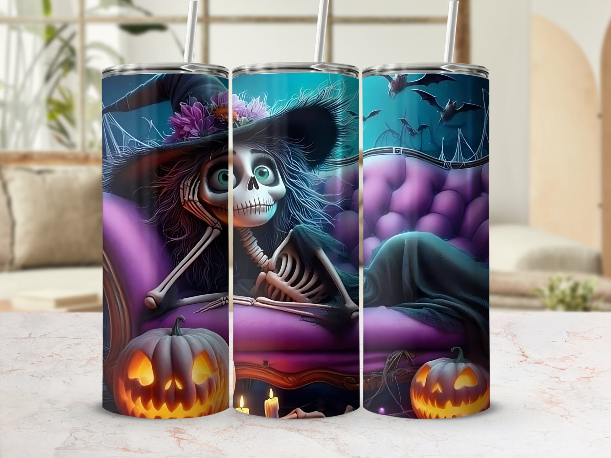 Halloween tumblers with a skeleton witch, bats, and jack-o'-lanterns.