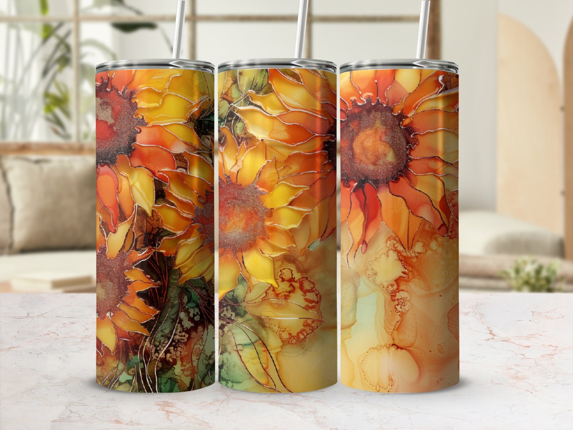Three tumblers with vibrant orange and yellow sunflower and abstract watercolor patterns.