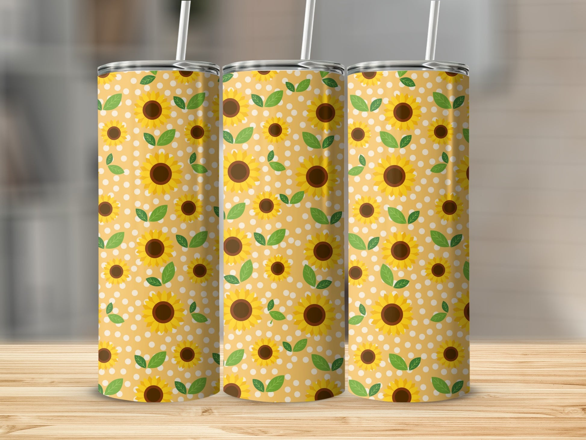Three tumblers with a yellow sunflower and polka dot pattern.