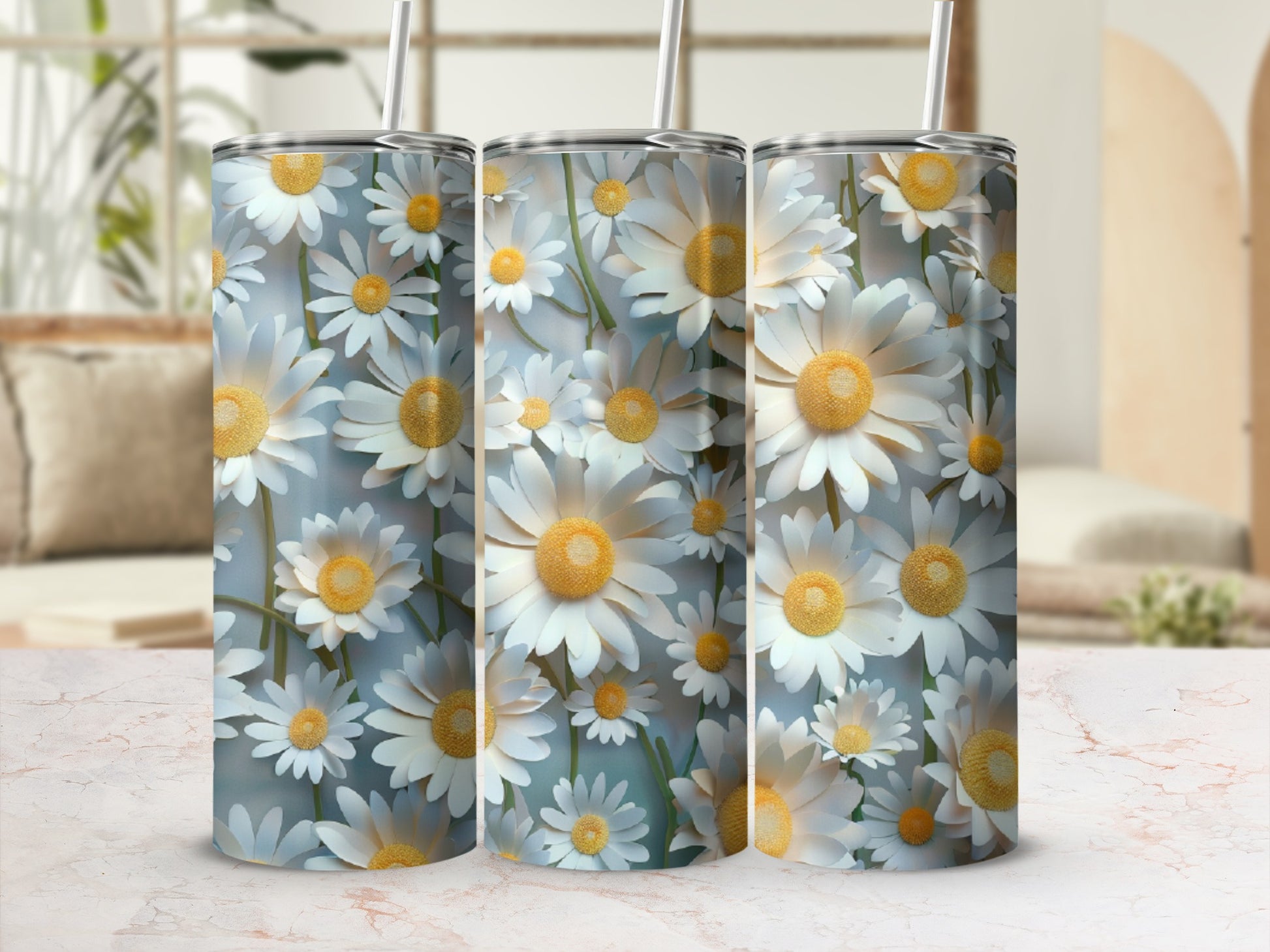 Three tumblers with a white daisy floral pattern and straws.