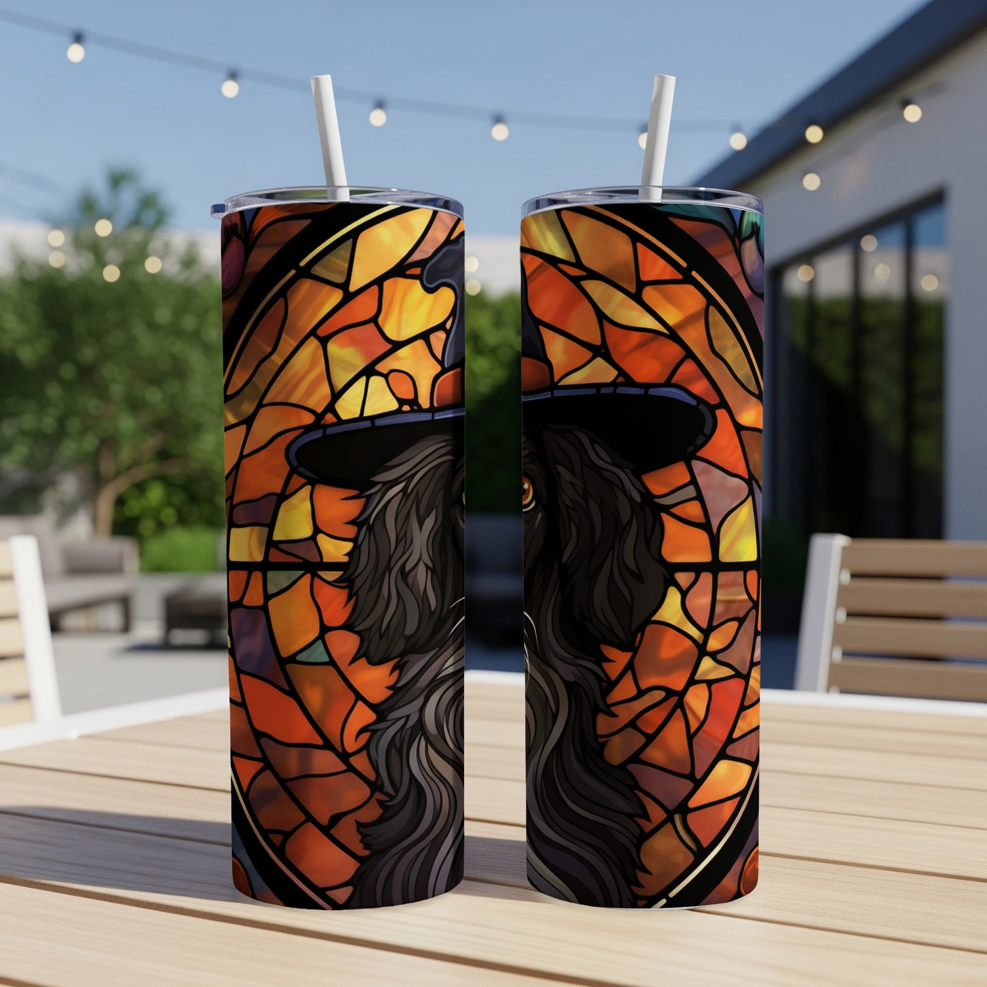 Two stained-glass effect tumblers featuring a black dog wearing a witch's hat.