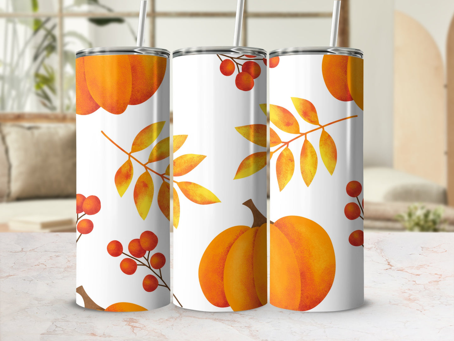 Three tumblers with a fall leaf and pumpkin pattern.