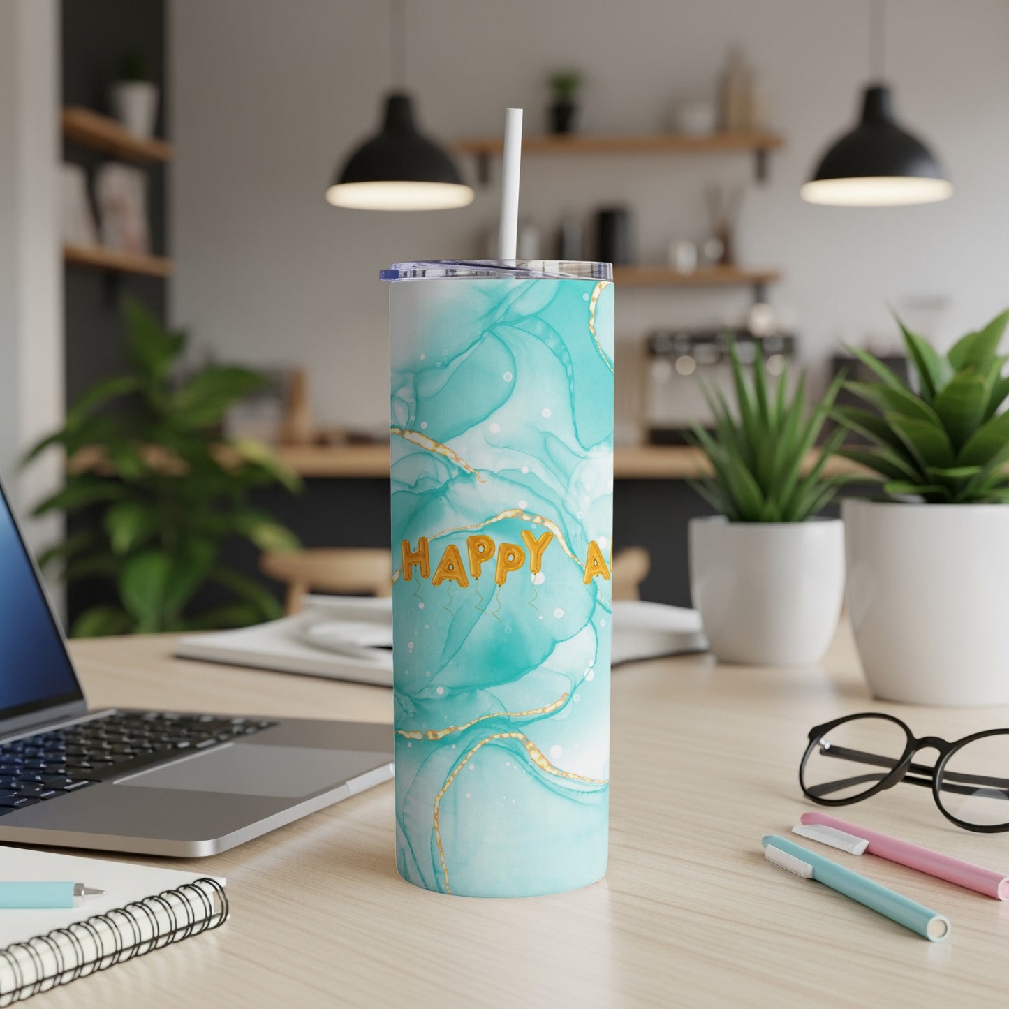 Turquoise marble tumbler with gold "Happy A" text and white straw.