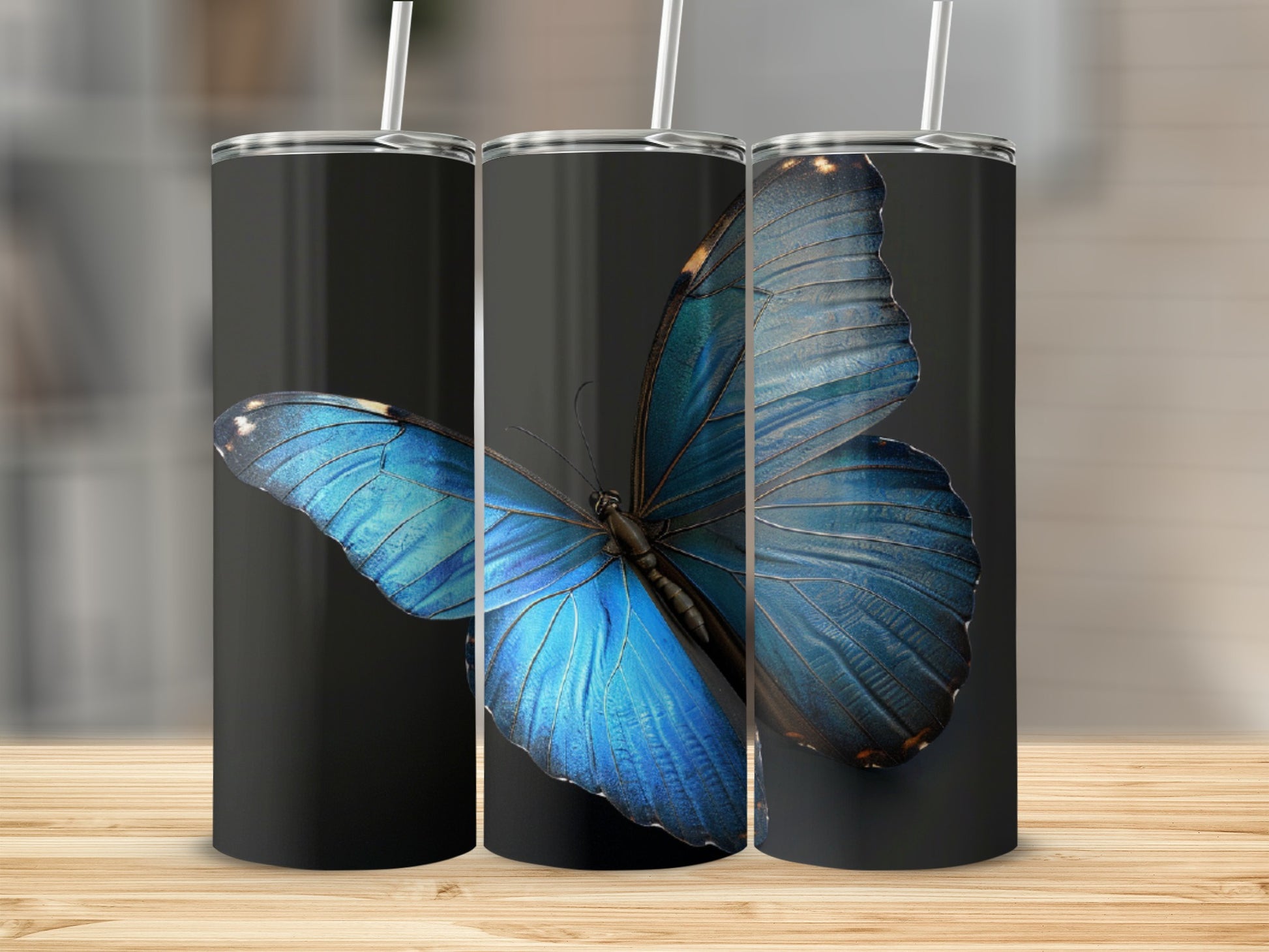 Three tumblers featuring a detailed blue butterfly design.