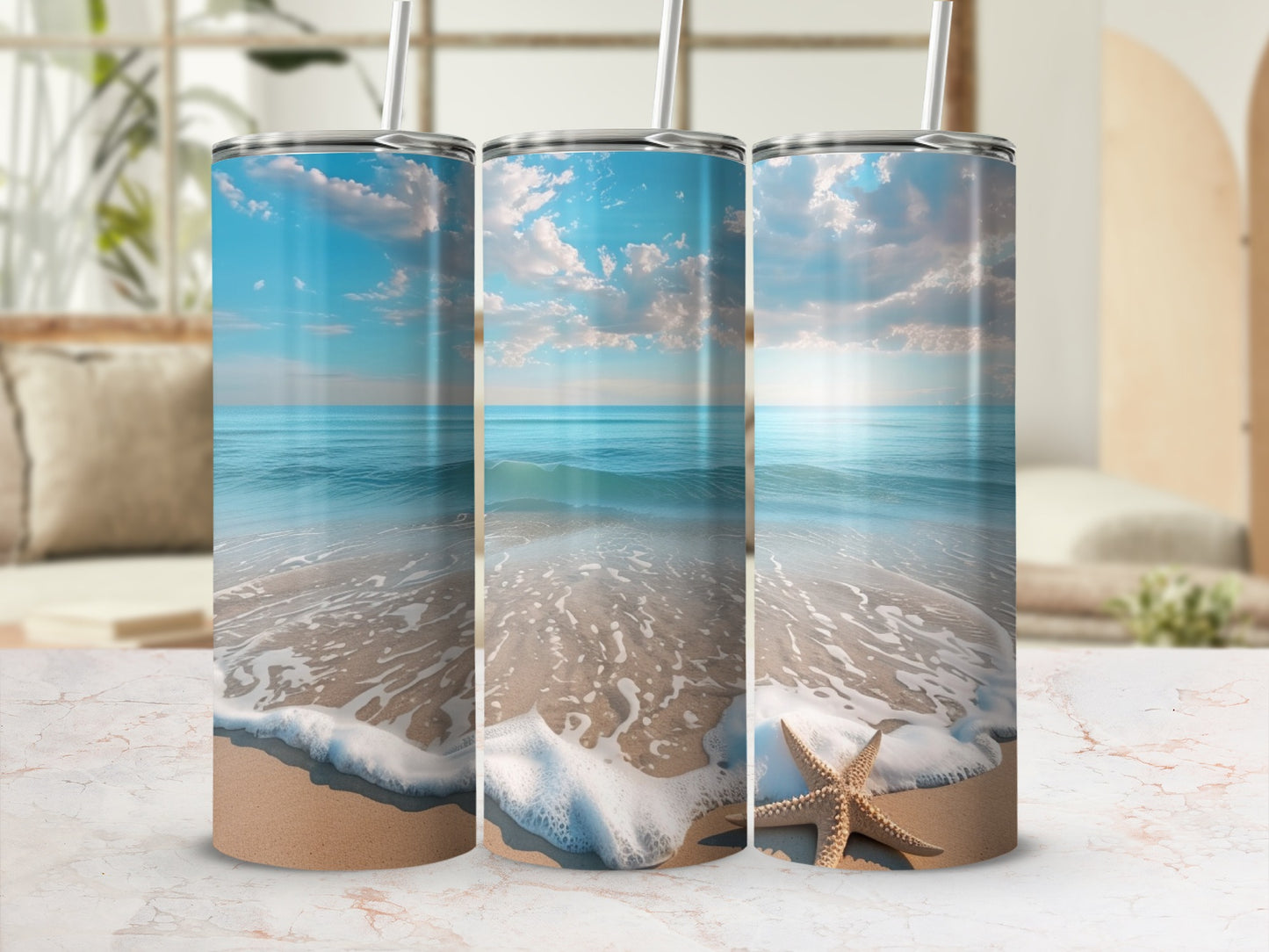 Three tumblers featuring a beach scene with ocean, sand, and a starfish.