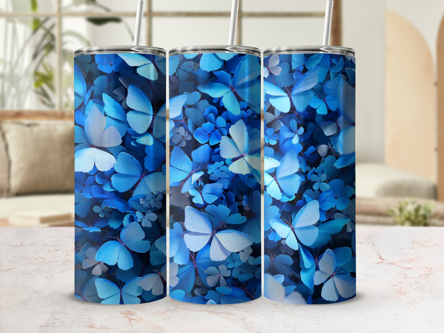 Three tumblers with a blue butterfly and floral pattern.