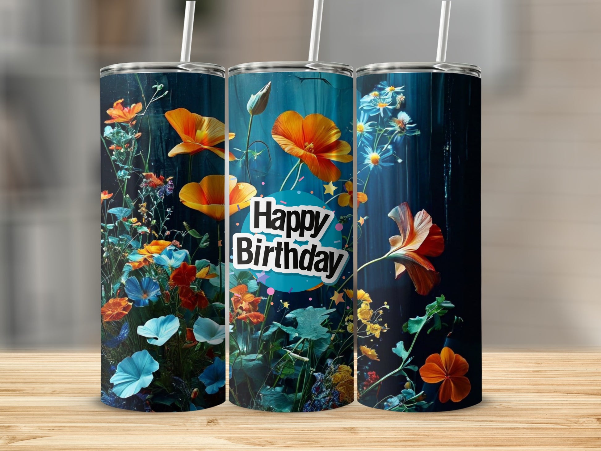 Three tumblers with vibrant floral designs and "Happy Birthday" text.