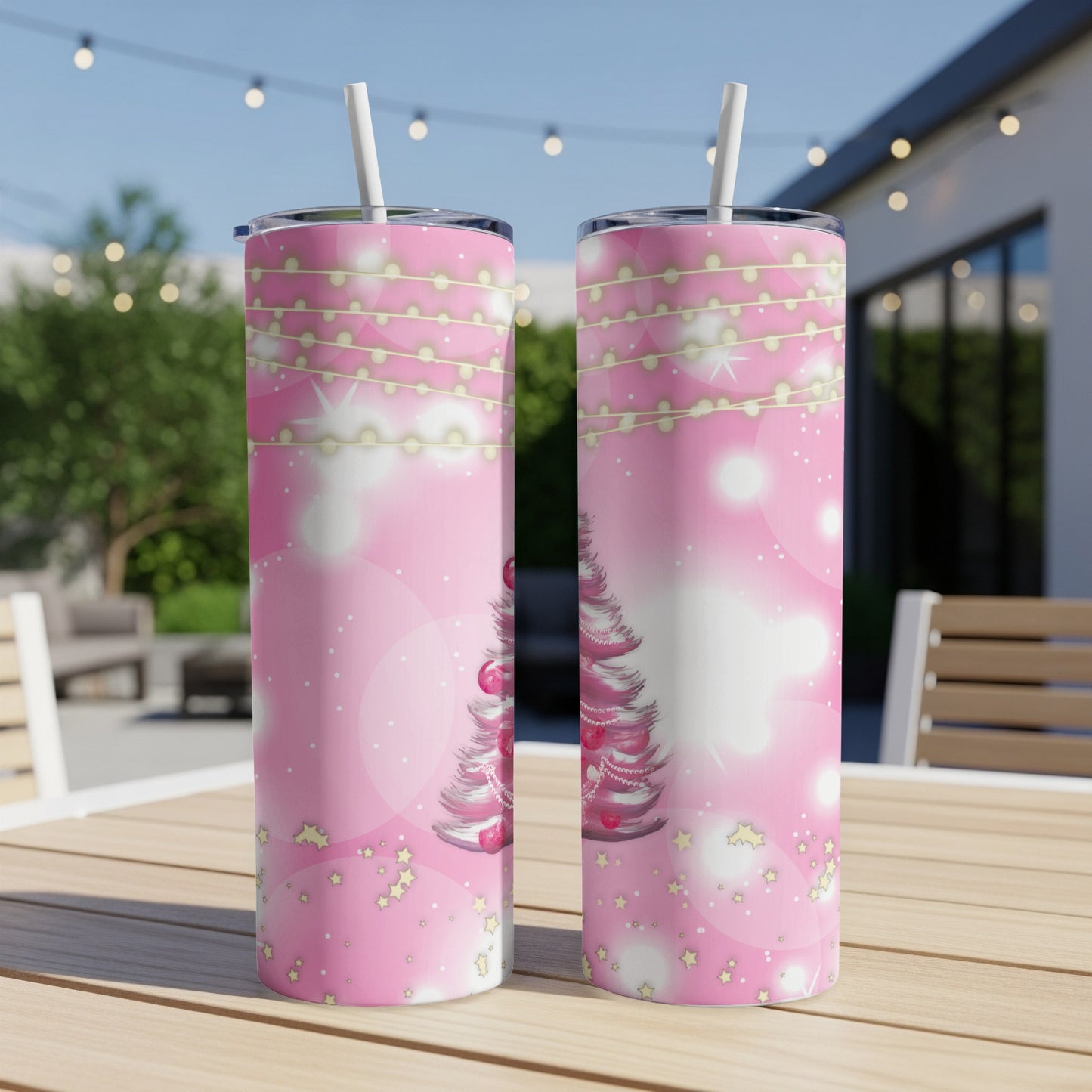 Pink Christmas tree tumbler with fairy lights and stars design.