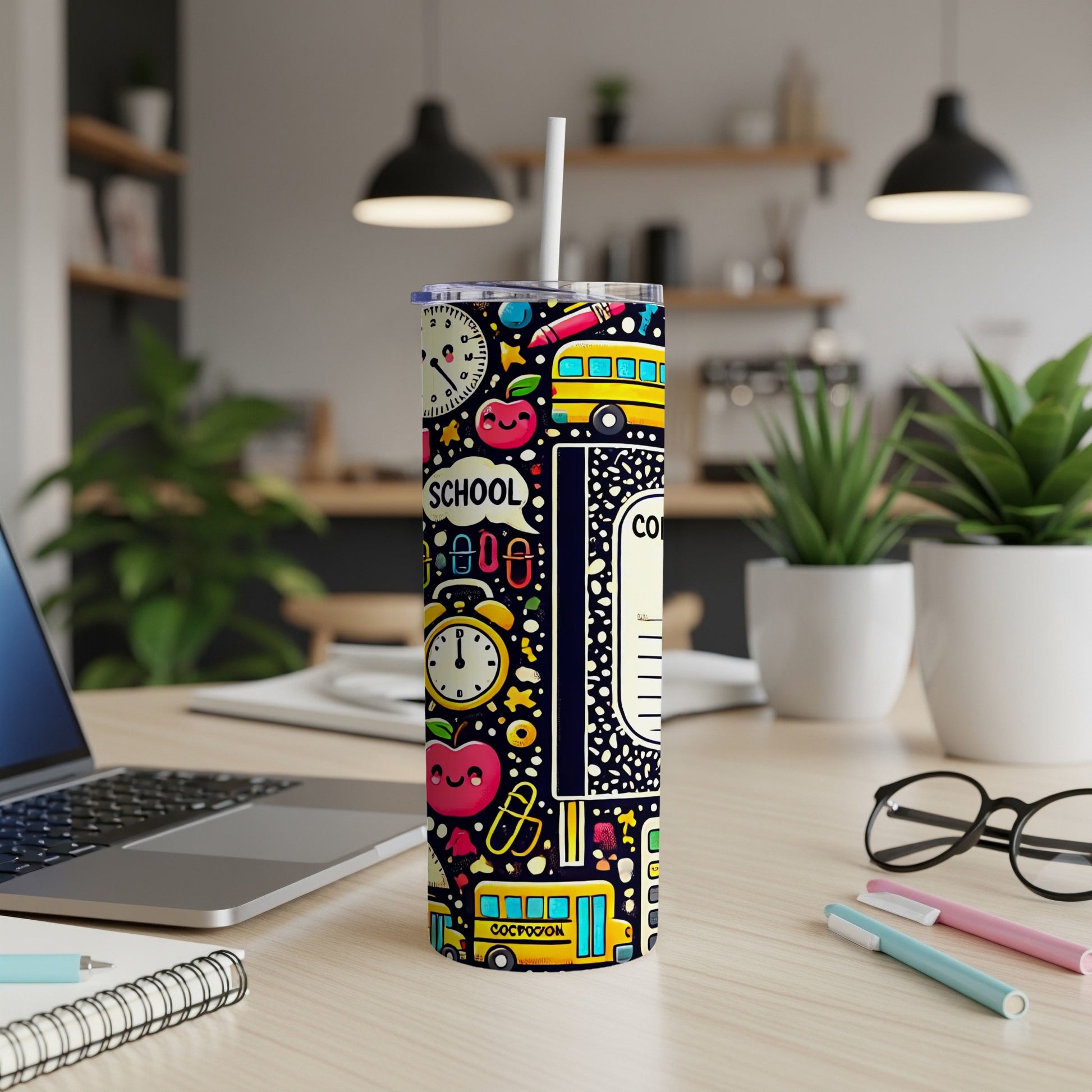 Tumbler with school-themed design featuring apples, buses, clocks, and pencils.