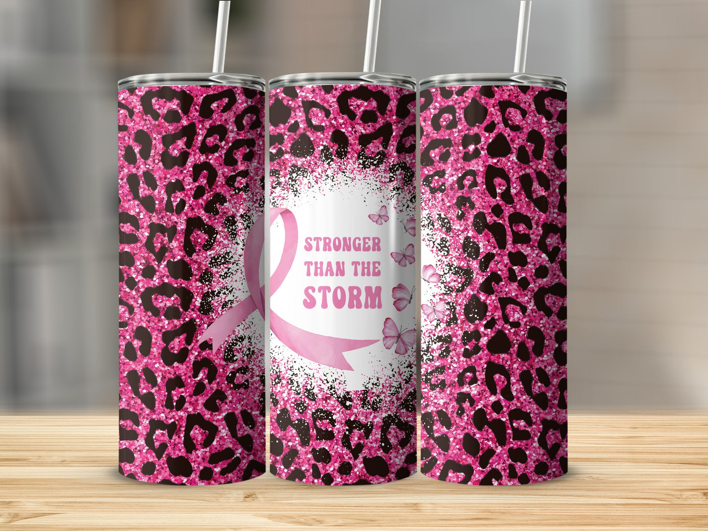 Pink leopard print tumbler with "Stronger Than The Storm" and butterflies.