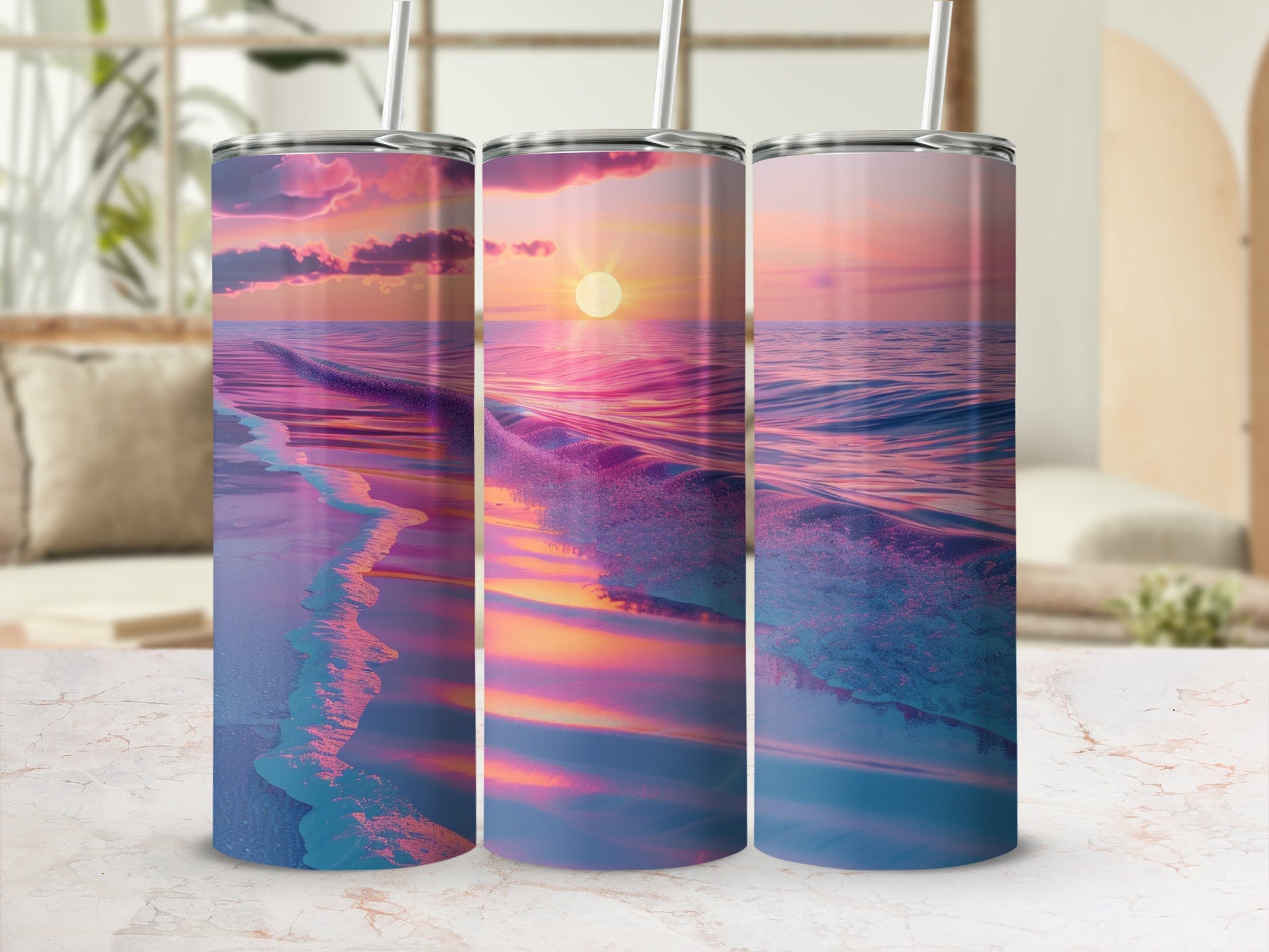 Three tumblers featuring a vibrant sunset over ocean waves.