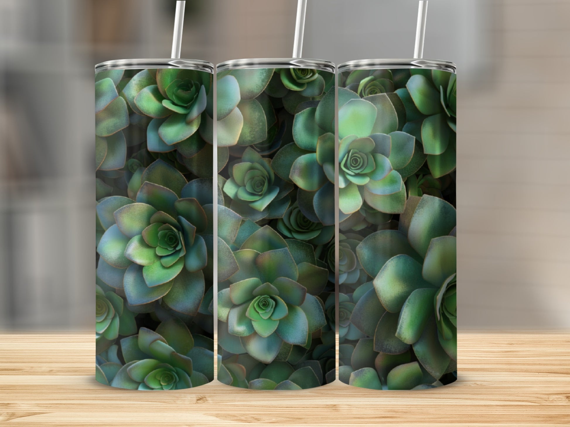 Green succulent plant pattern on three tumblers with straws.