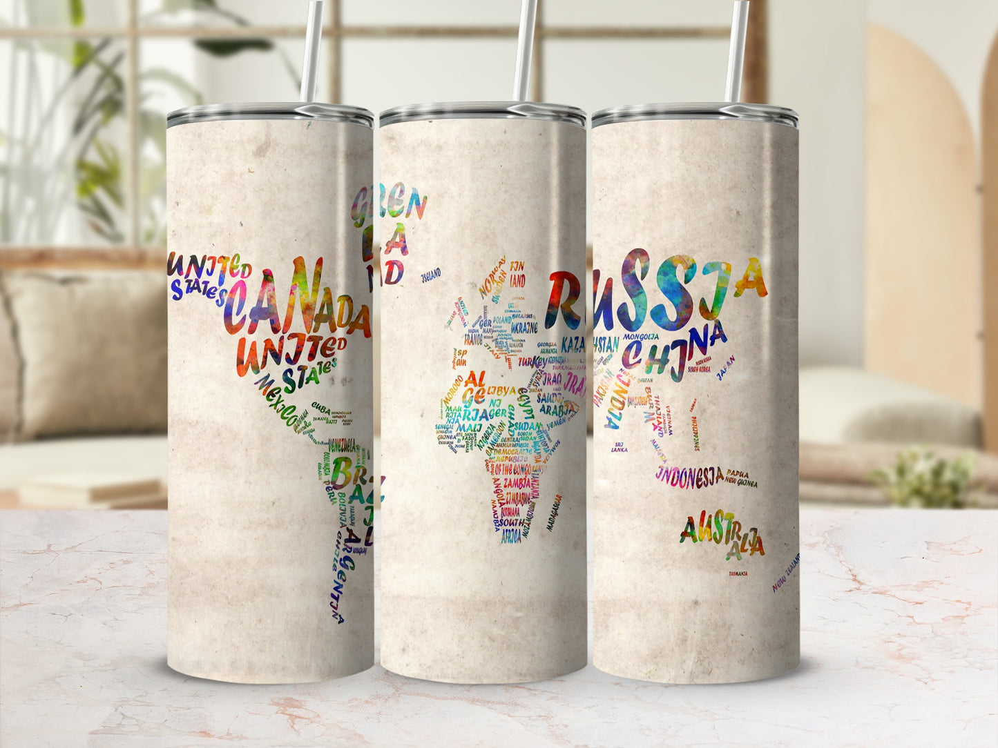 Three tumblers with colorful world maps made of country names.