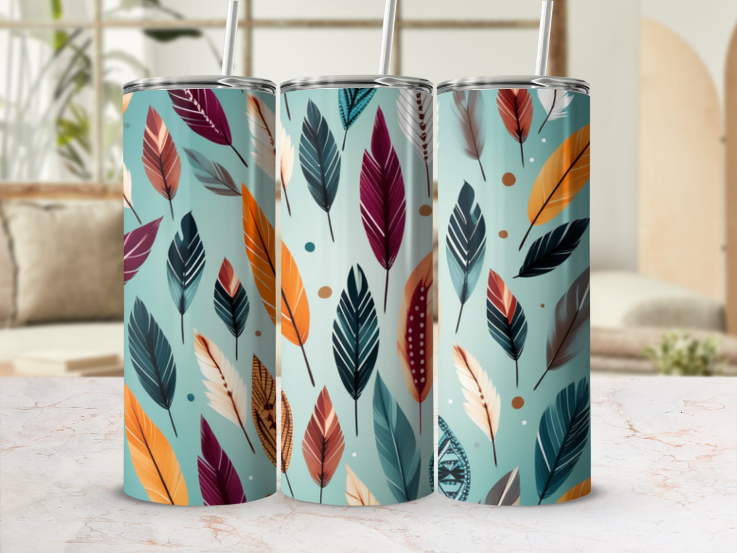 Three tumblers with a teal background and colorful feather patterns.