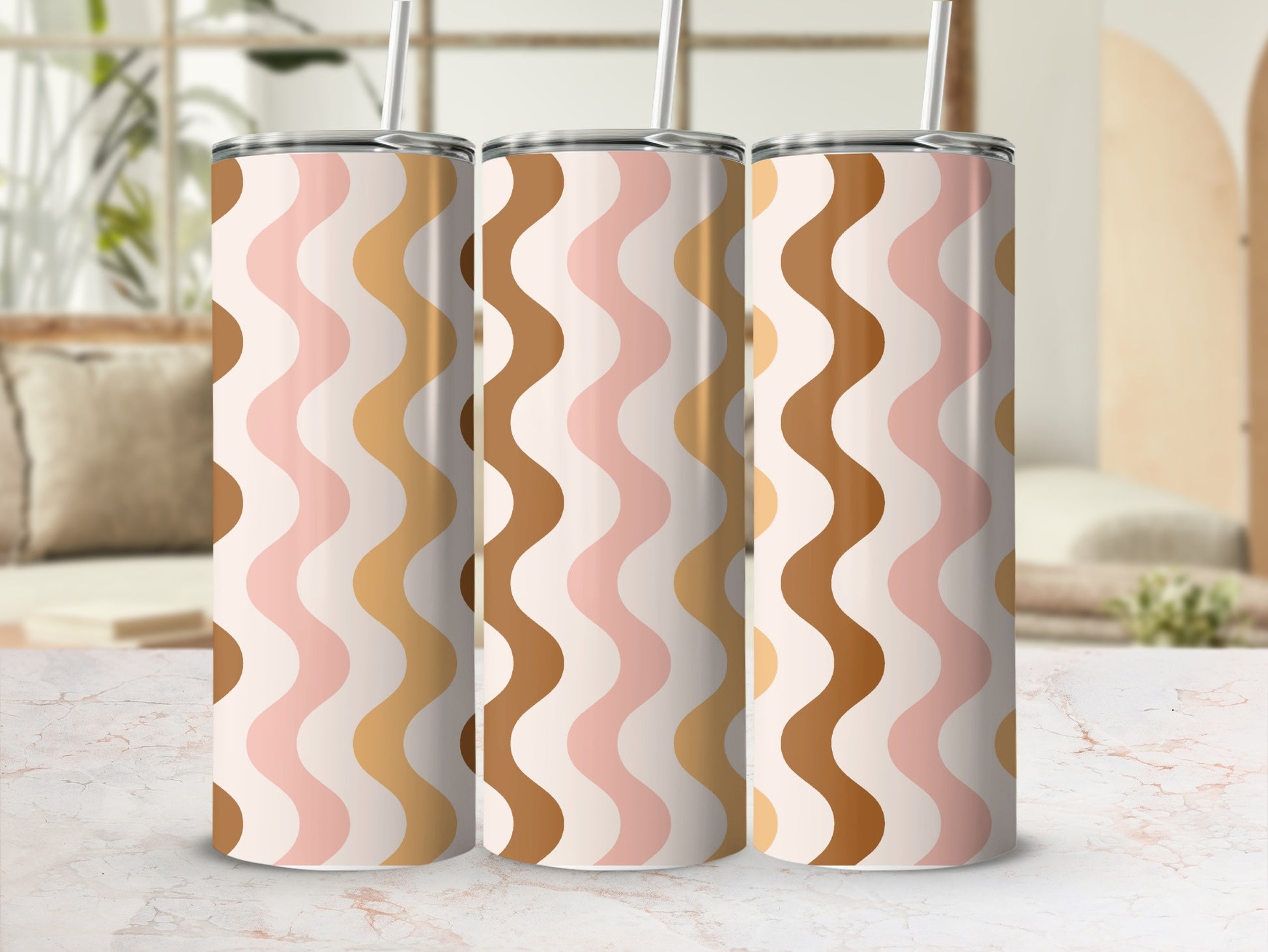 Three stainless steel tumblers with a wavy stripe pattern in pink, beige, and brown.