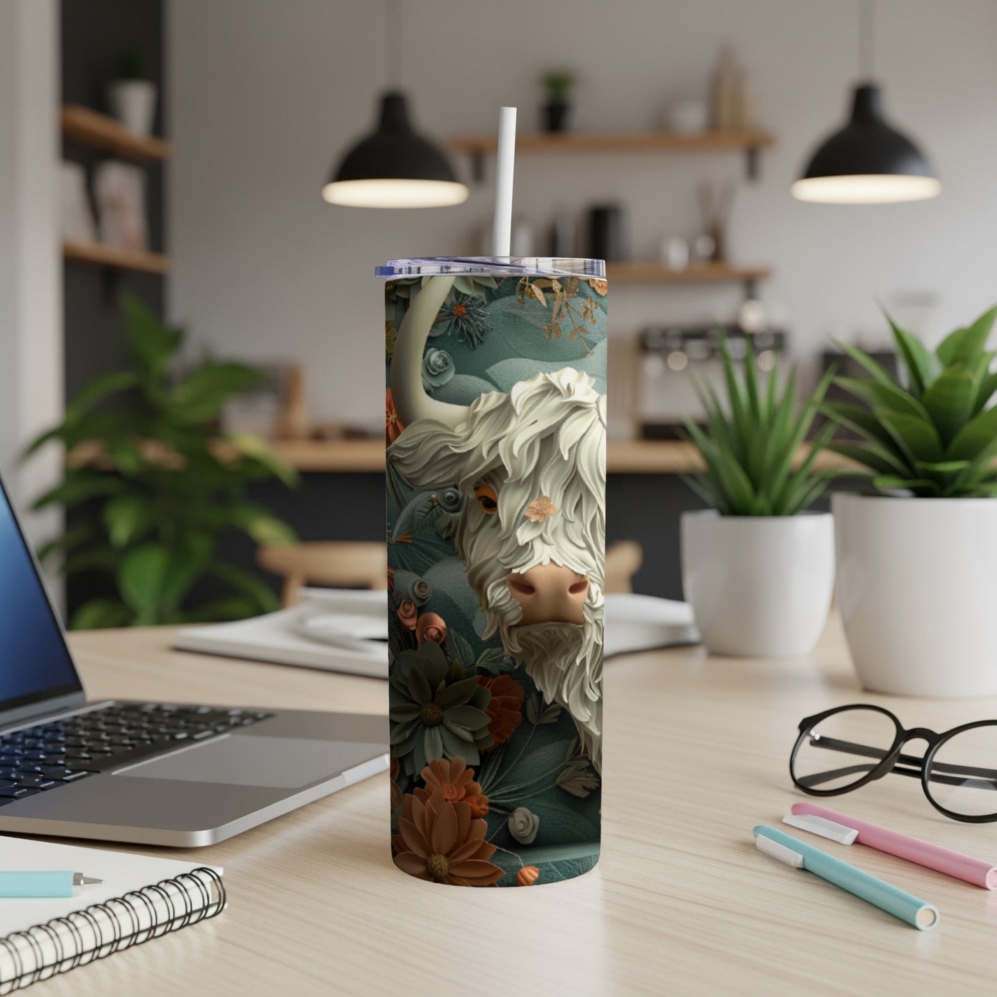 White shaggy cow and floral design on a white tumbler with straw.