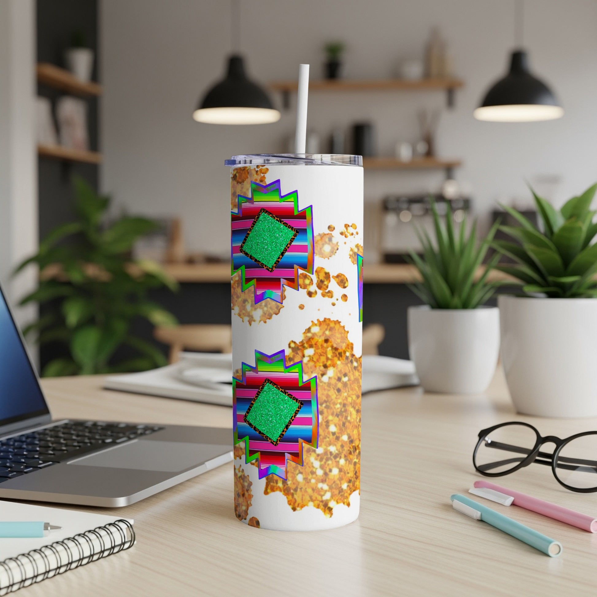 White tumbler with geometric Southwestern pattern and glitter accents.