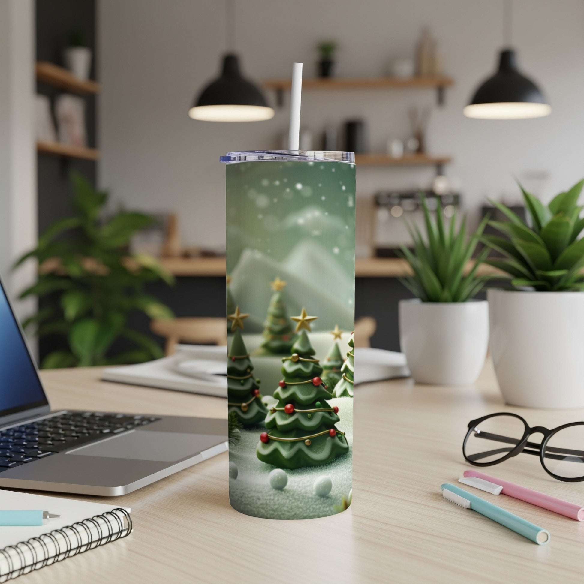 Tumbler with a festive winter wonderland scene of decorated Christmas trees.