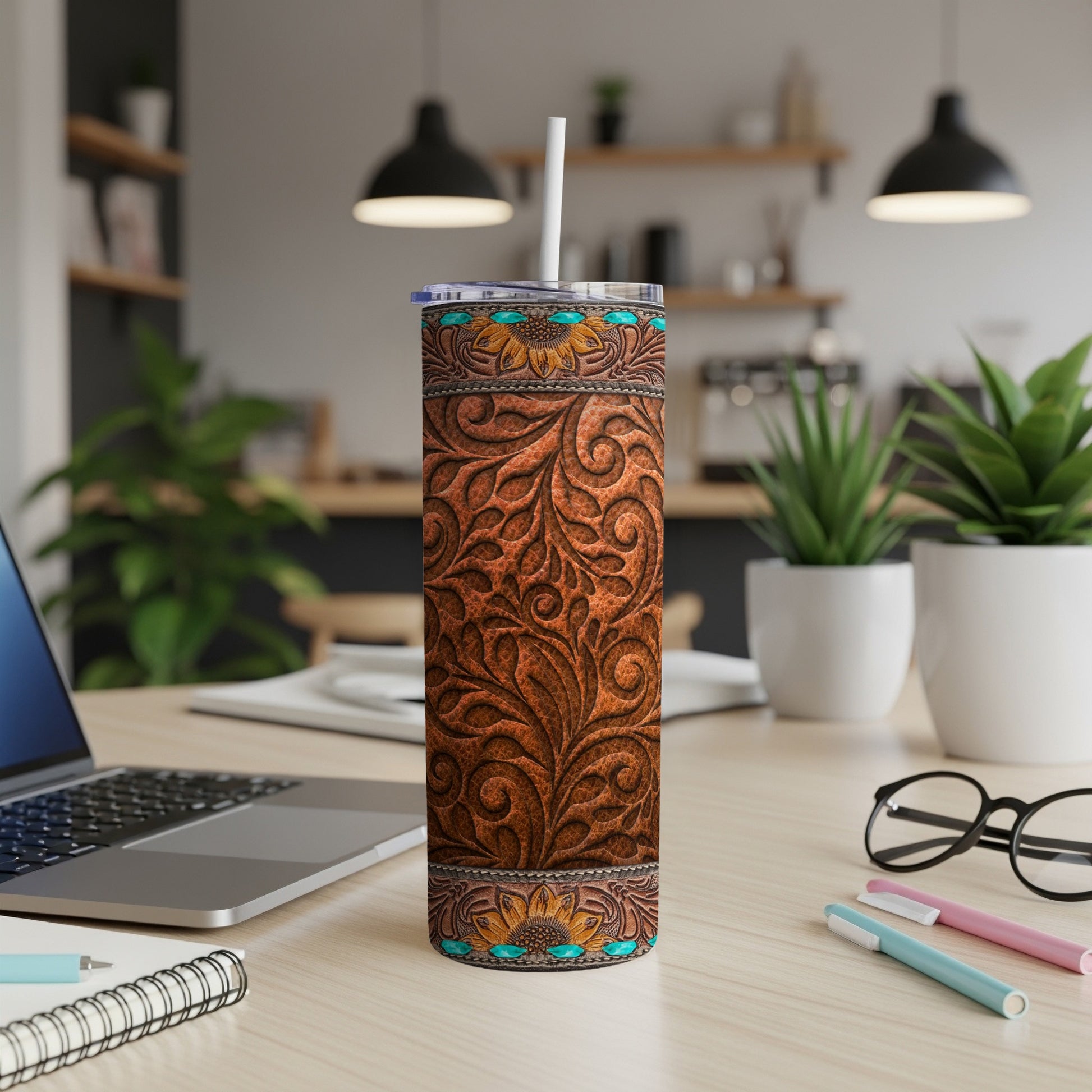 Brown leather tumbler with embossed floral pattern and turquoise accents.