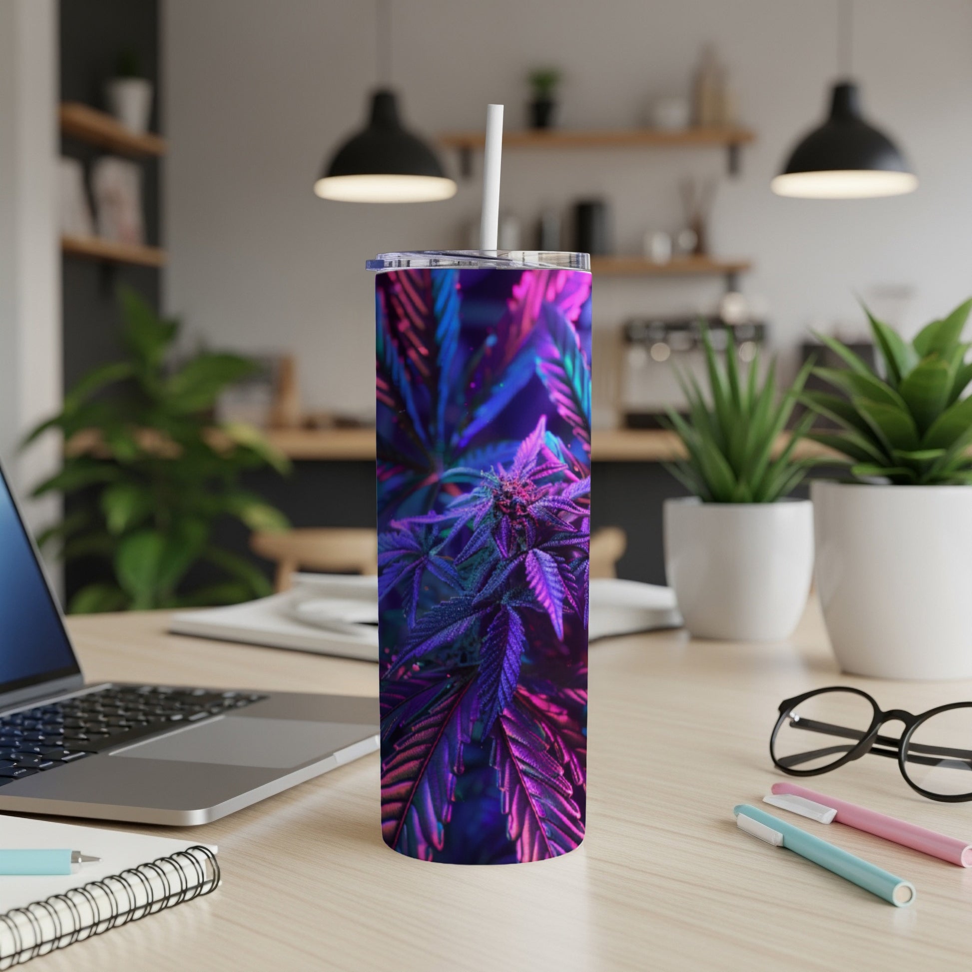 Purple cannabis bud and leaves on a modern tumbler with a straw.